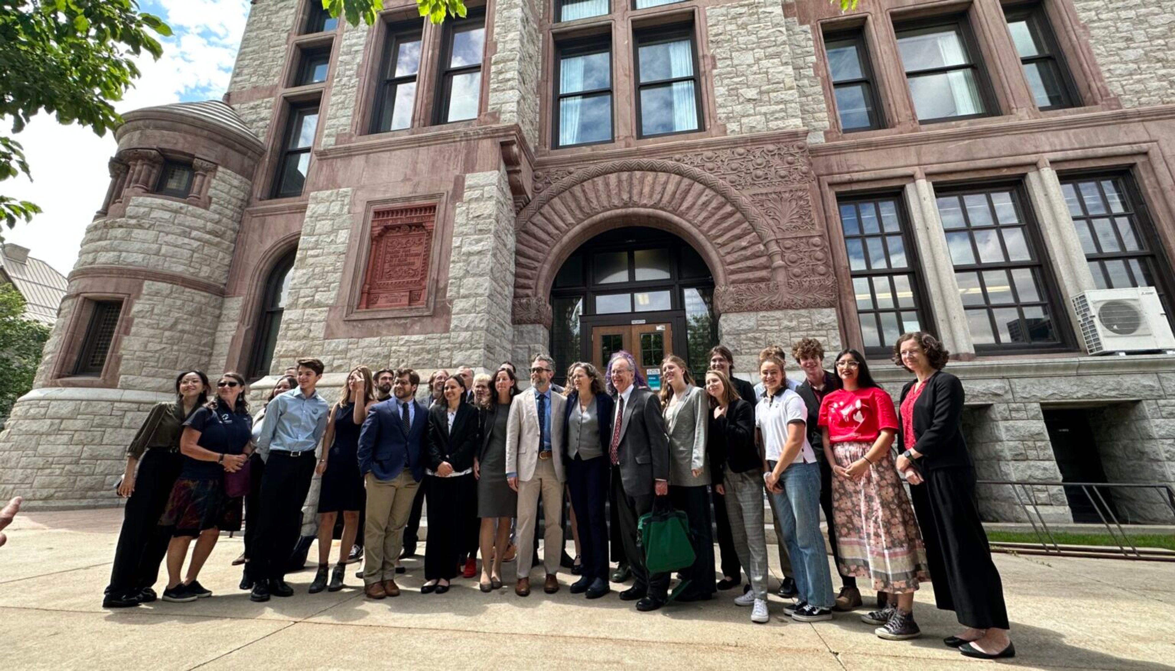 Most of the Held v. Montana plaintiffs and their attorneys pose outside the courtroom for photos halfway through the trial.