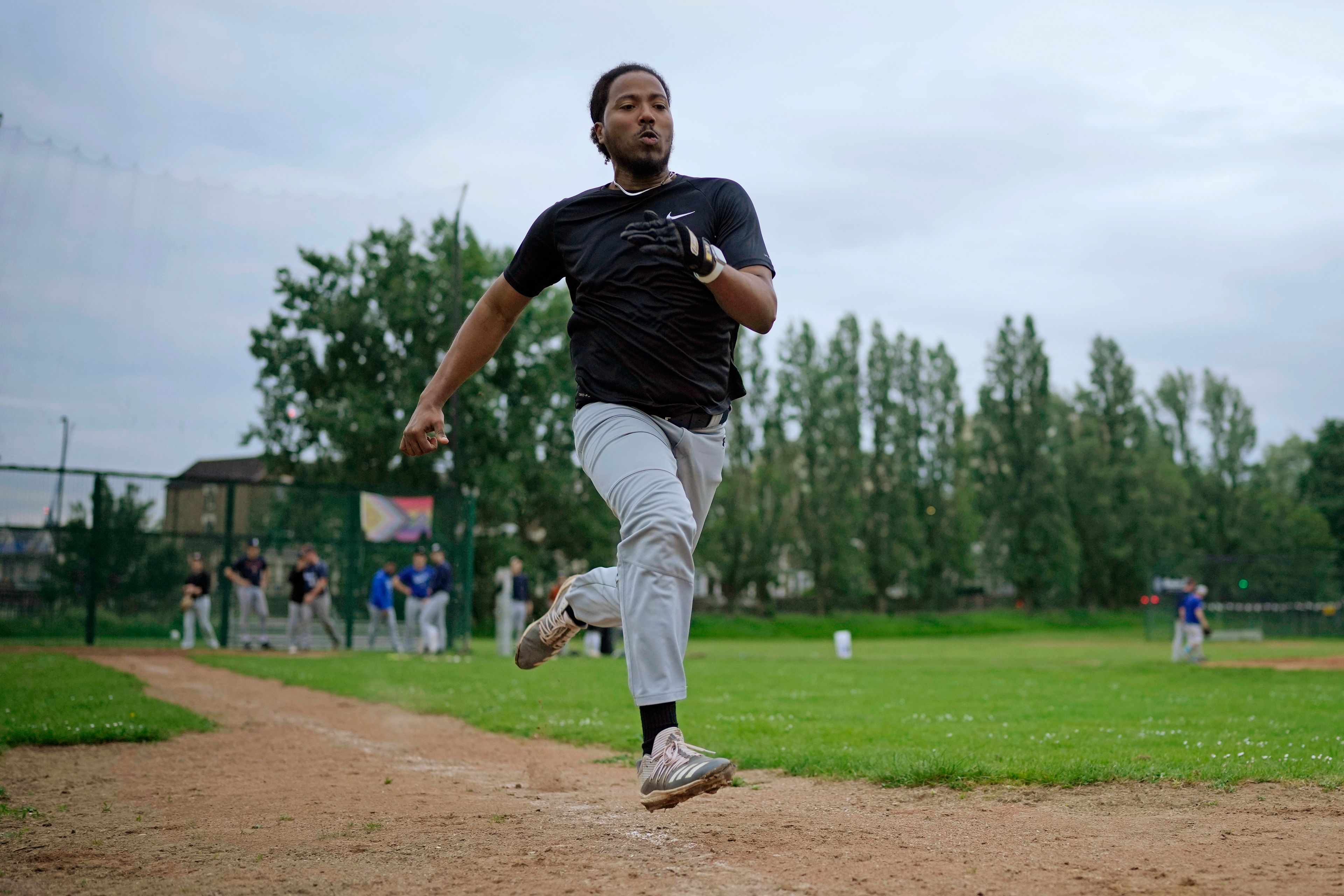 A member of the UK baseball team London Mets runs during a training session at the Finsbury Park in London, Thursday, May 16, 2024. Baseball at the highest club level in Britain is competitive. Teams are mélange of locals and expats some with college and minor league experience.