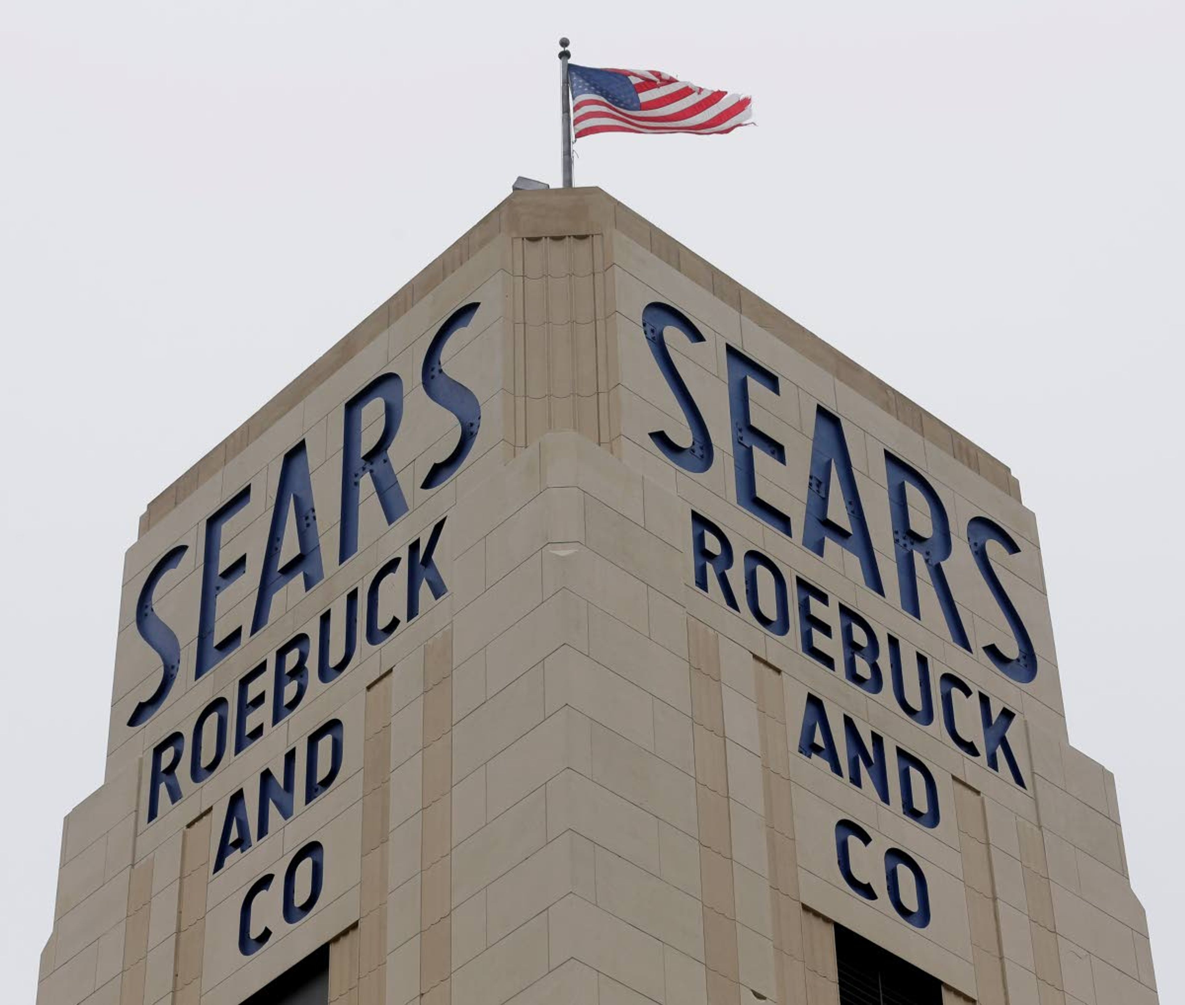 A flag flies Tuesday above a Sears store in Hackensack, N.J.