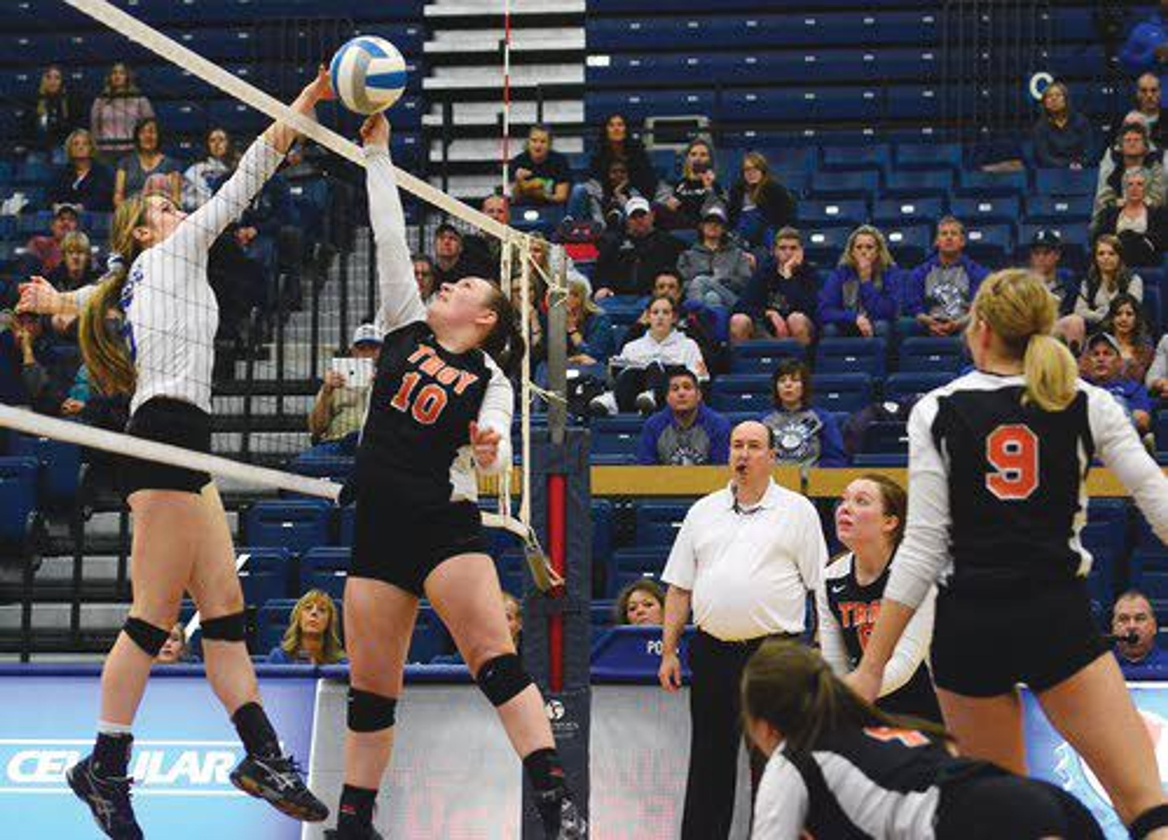 Genesee outside hitter Courtney Burt, left, and Troy setter Sarah Fry vie for a ball at the net during the first set of the Class 1A Division 1 District II Championship Game on Tuesday night at the Lewis Clark State College Activity Center in Lewiston.