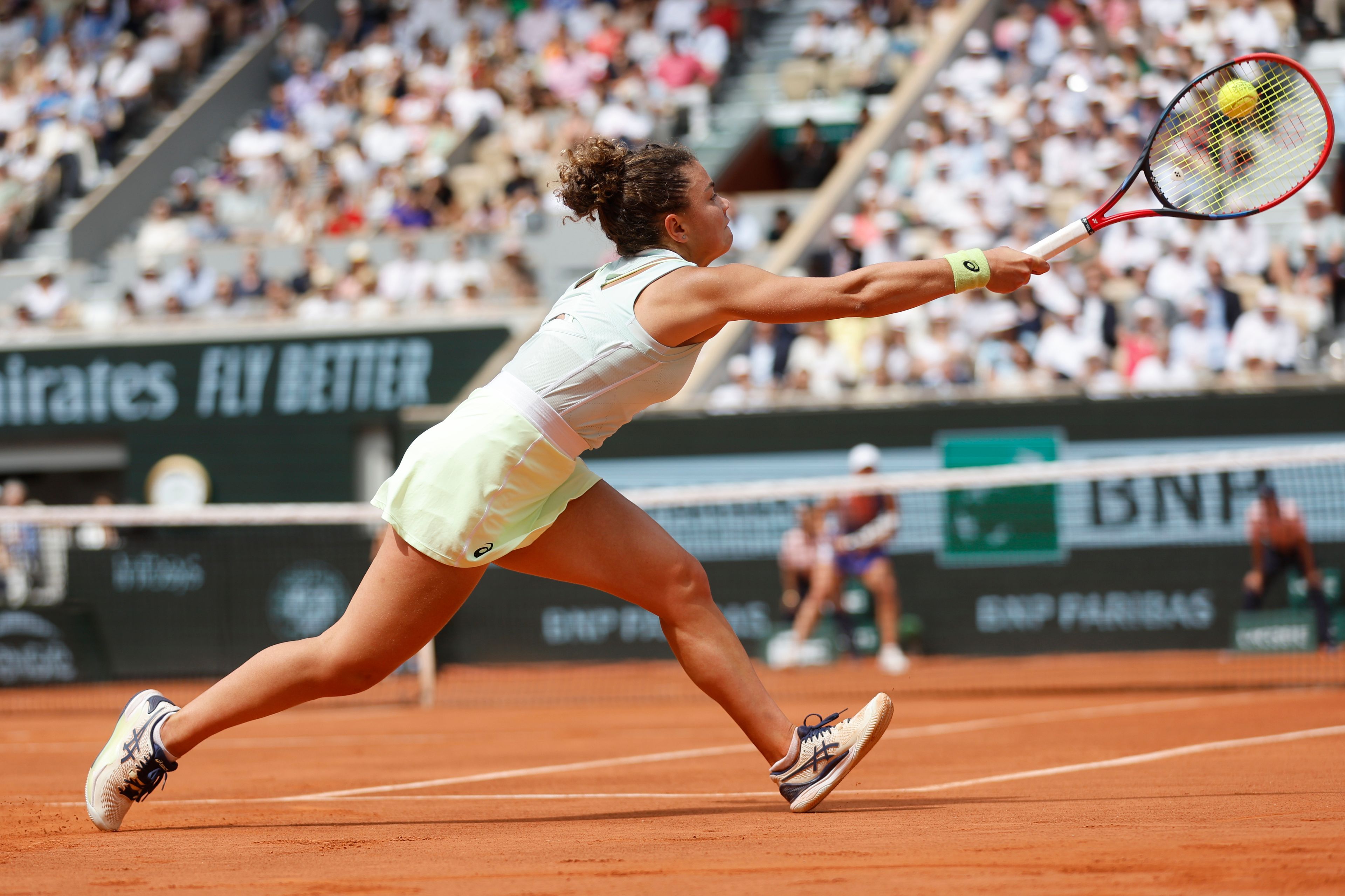 Italy's Jasmine Paolini plays a shot against Poland's Iga Swiatek during the women's final of the French Open tennis tournament at the Roland Garros stadium in Paris, France, Saturday, June 8, 2024.