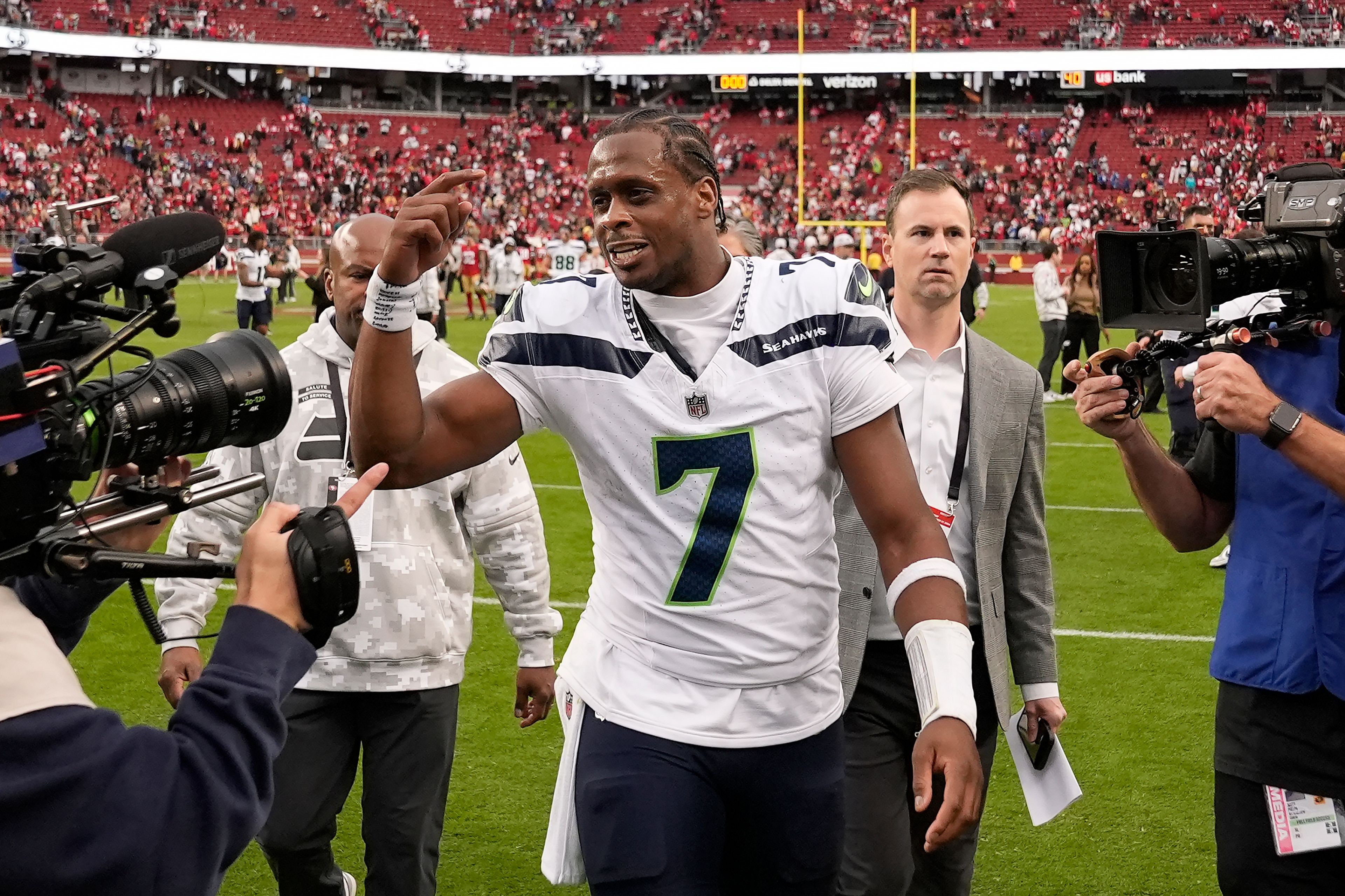 Seattle Seahawks quarterback Geno Smith (7) celebrates as he walks off the field after an NFL football game against the San Francisco 49ers on Sunday, Nov. 17, 2024. in Santa Clara, Calif.