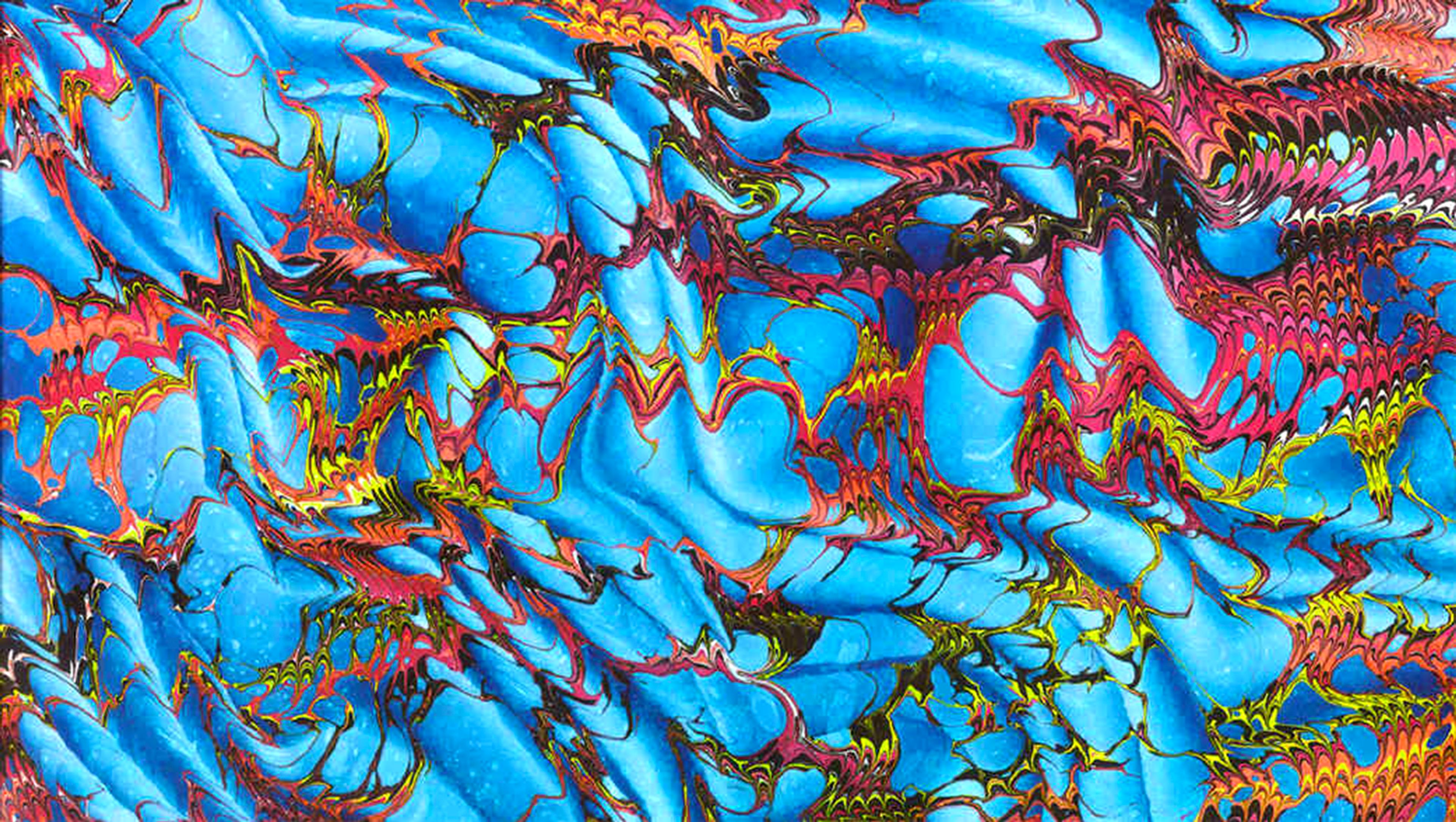 Dragons in the Sky: The most popular one of all that I make -- an unusual but effective combination of red, yellow and orange, in a network which appears to be on top of the turquoise background. Actually the turquoise is the last color applied, after the other colors have been combed. It is printed on folded paper, forming this pattern (which is the same as a "fantasy moiré") when it is flattened out.