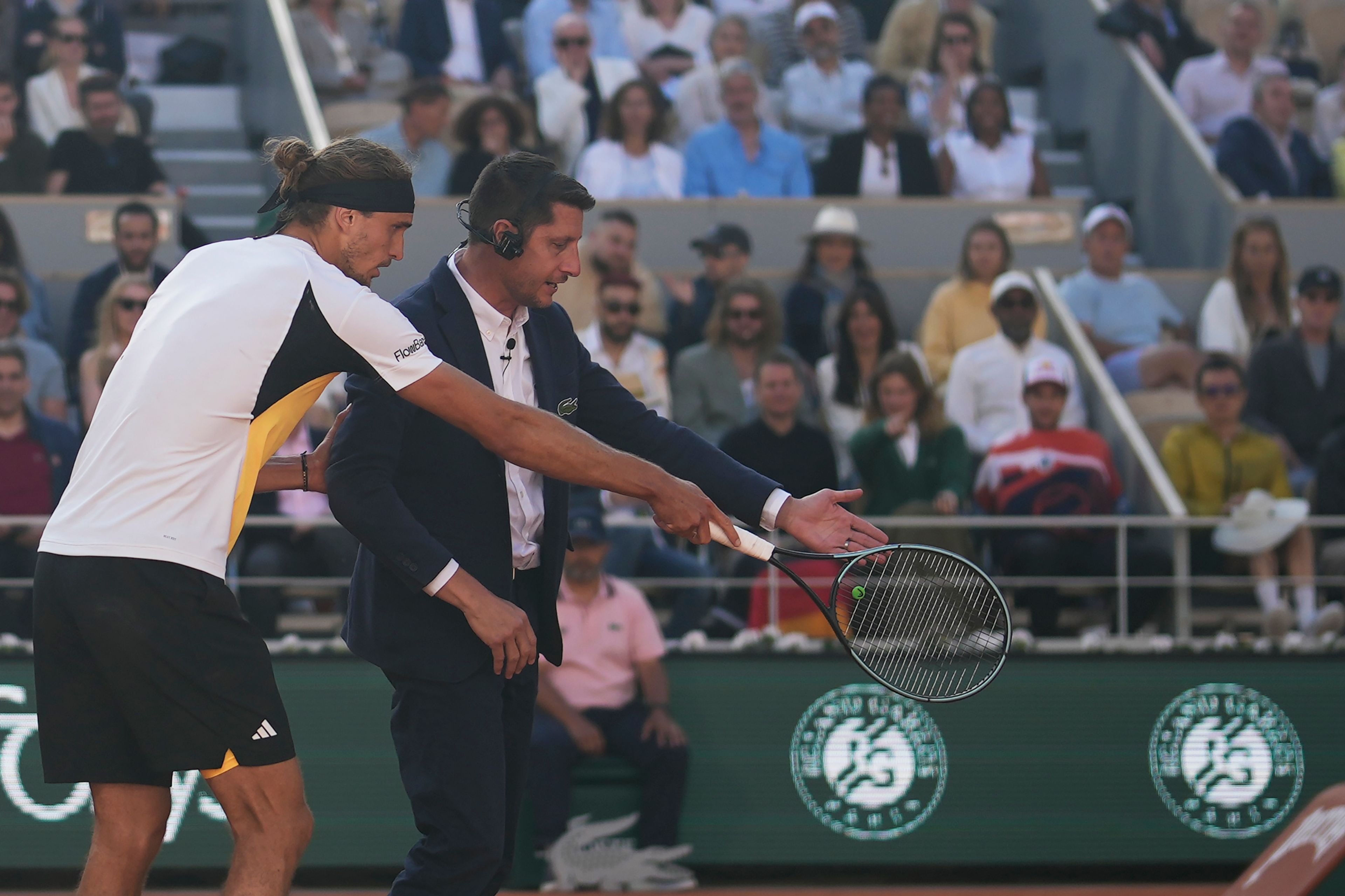 Germany's Alexander Zverev argues over a referee decision as he plays against Spain's Carlos Alcaraz during the men's final match of the French Open tennis tournament at the Roland Garros stadium in Paris, Sunday, June 9, 2024.