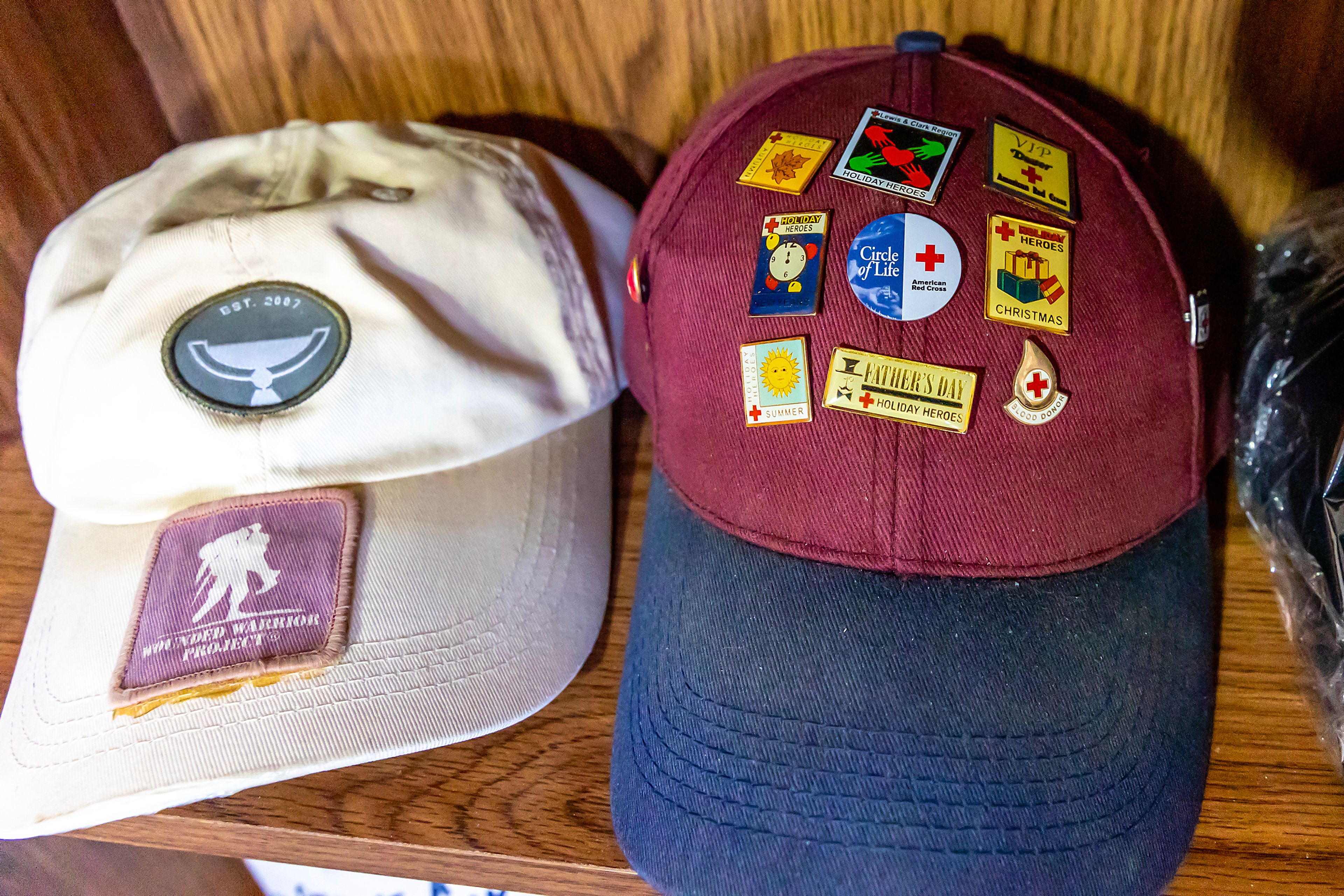 A hat displaying pins for the times Johnny Wells donated blood is pictured Tuesday at his home in Clarkston.