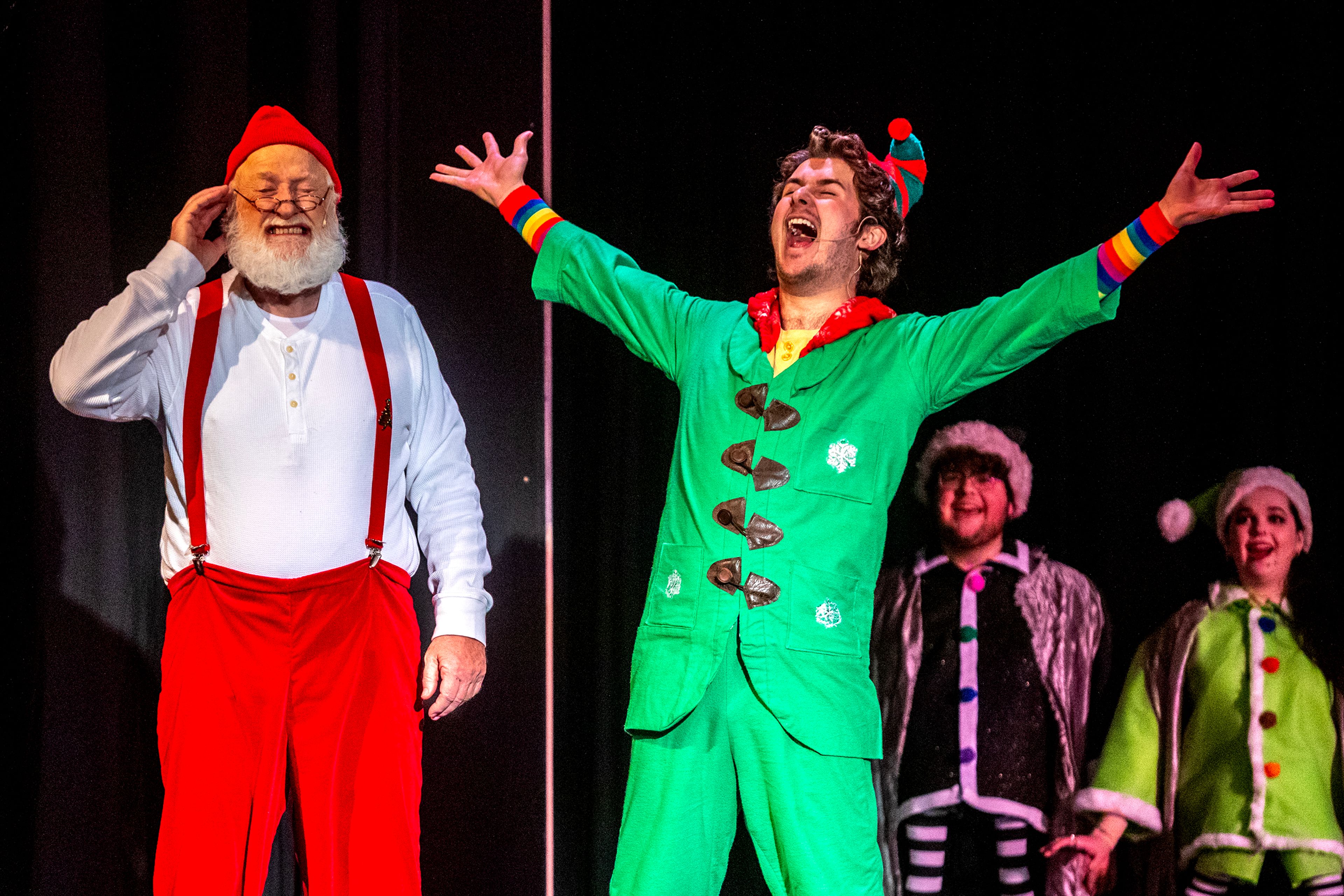 Buddy, played by Alex Everett, sings loudly to the displeasure of Santa, played by Santa Lew, at a rehearsal for the Civic Theatre production of “Elf” at the old Lewiston High School on Monday.