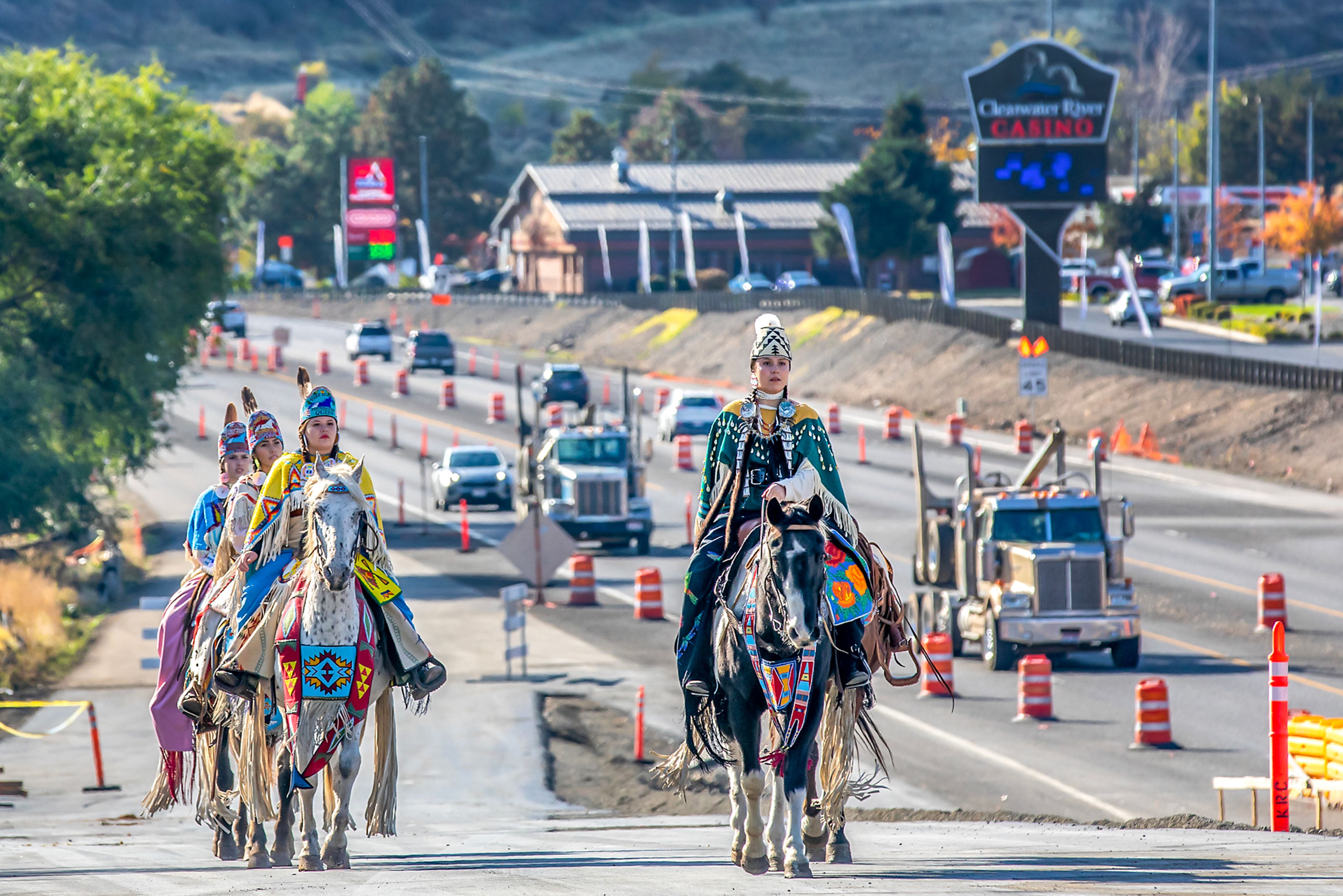 The Nimiipuu Riders walk up the ramp onto the new Aht�Wy Interchange to open the the ribbon cutting ceremony Thursday over U.S. Highway 95/12 in Lewiston.