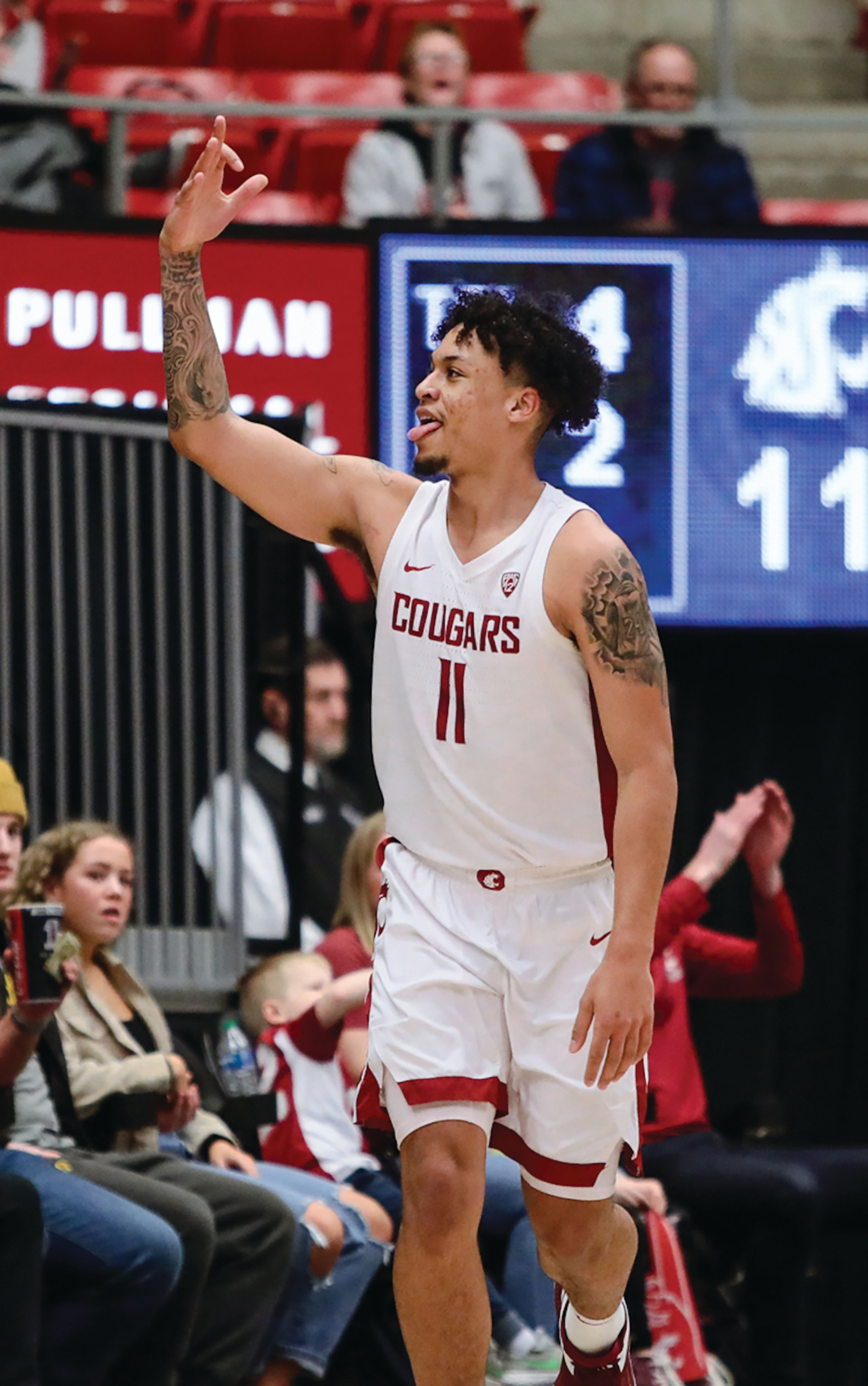 Washington State senior forward DJ Rodman celebrates a play during Saturday's Pac-12 Conference game against Stanford at Beasley Coliseum.