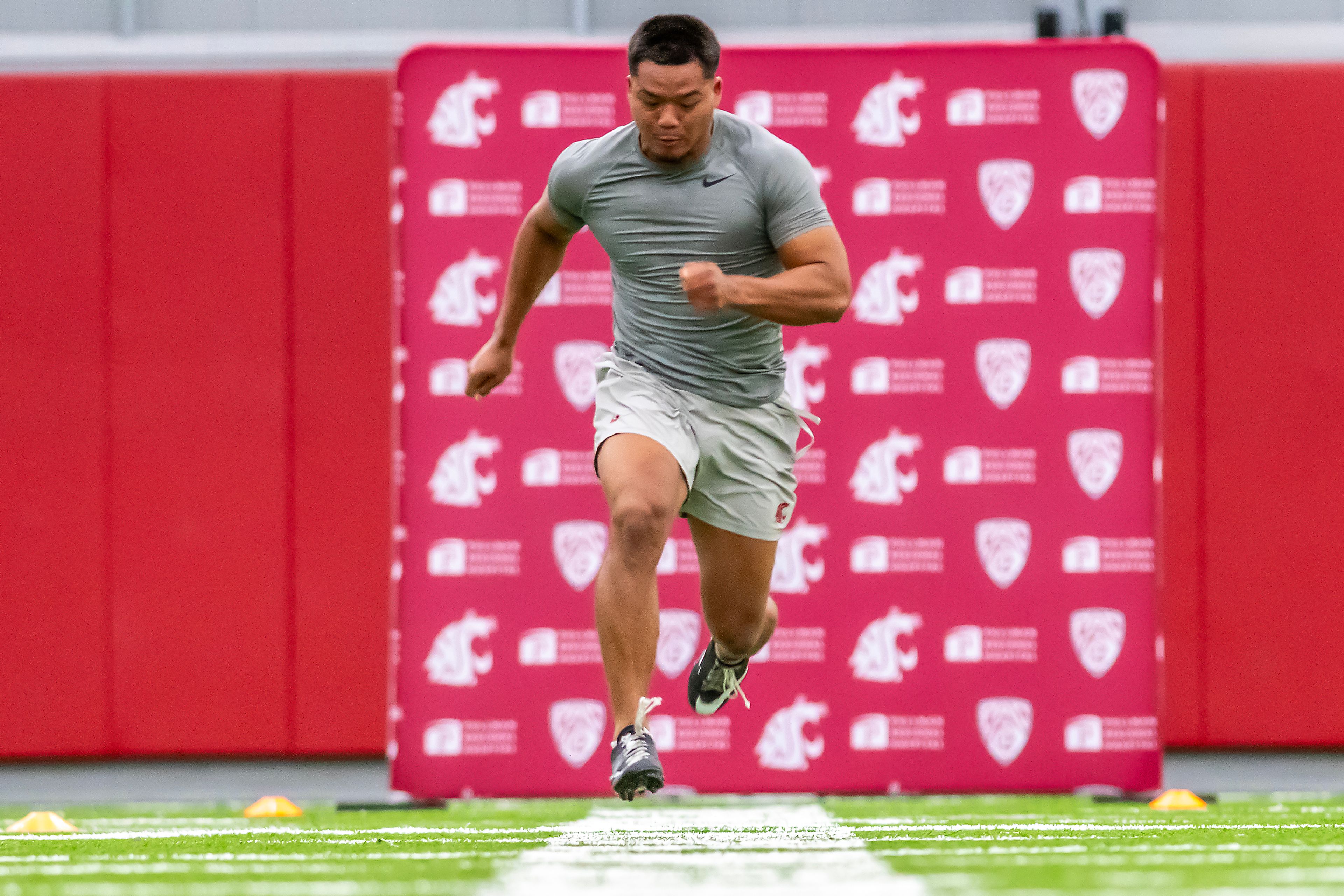 Washington State safety Tanner Moku runs the 40-yard dash during WSU's Pro Day on Friday in Pullman.