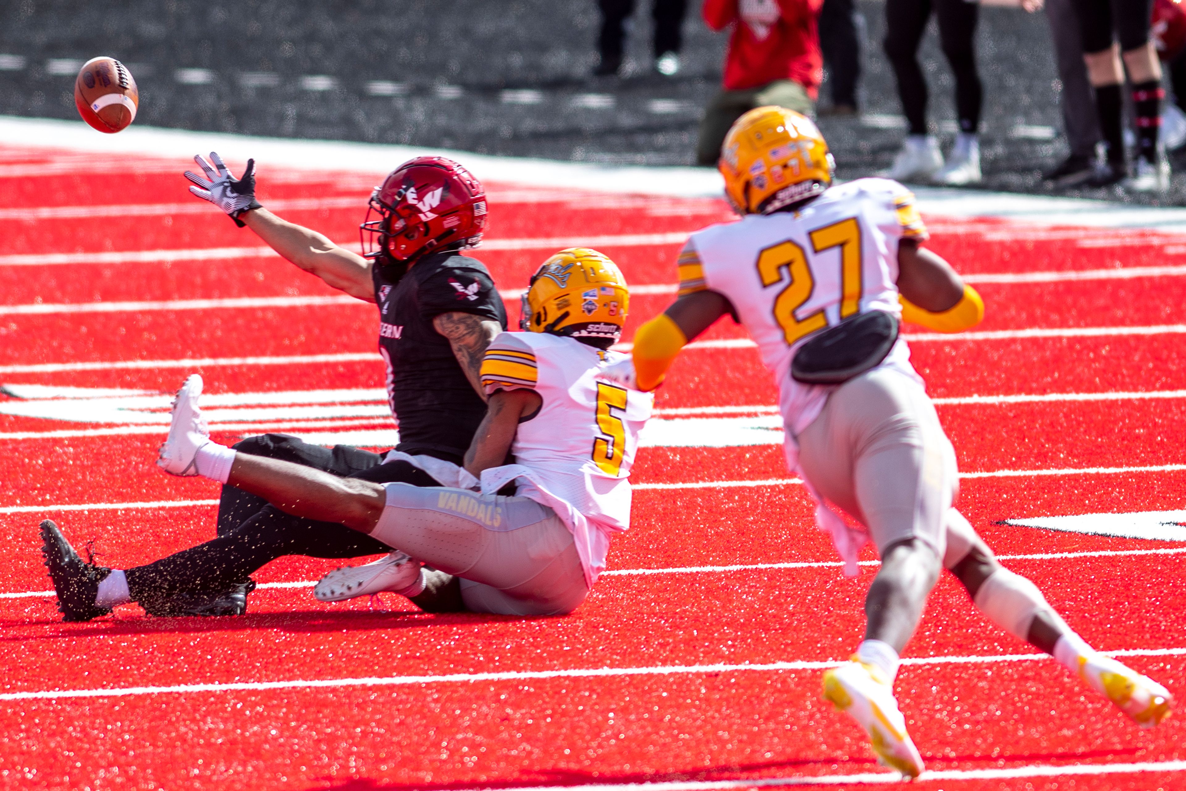 Idaho defensive back Dareon Nash (5) defends a pass attempt to Eastern Washington wide receiver Andrew Boston (9) during the third quarter of a Big Sky Conference matchup at Roos Field on Saturday afternoon. Eastern Washington defeated Idaho 38-31.