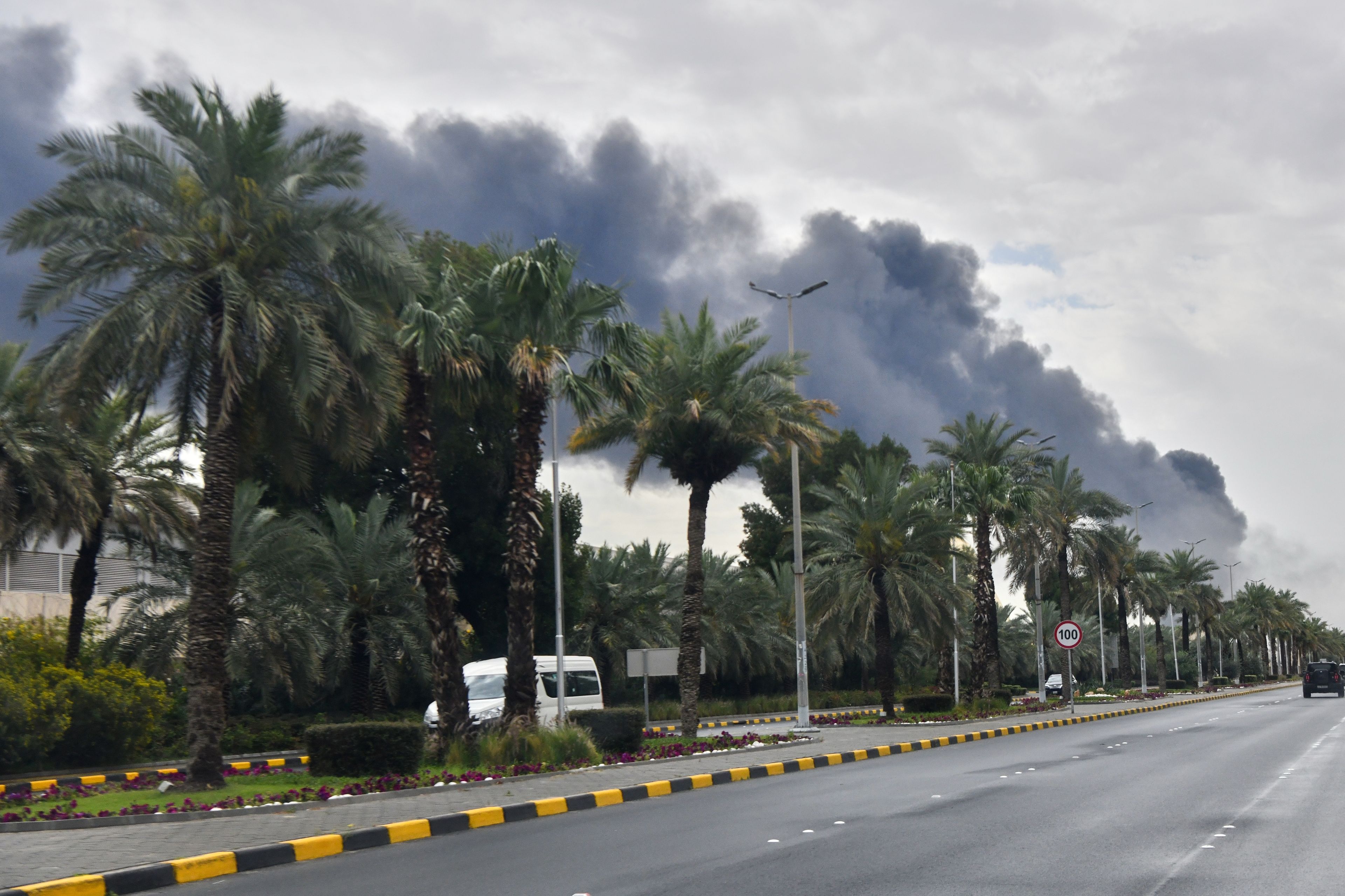Smoke rises from Kuwait international airport after a drone strike Friday on fuel storage in Kuwait City, Kuwait.
