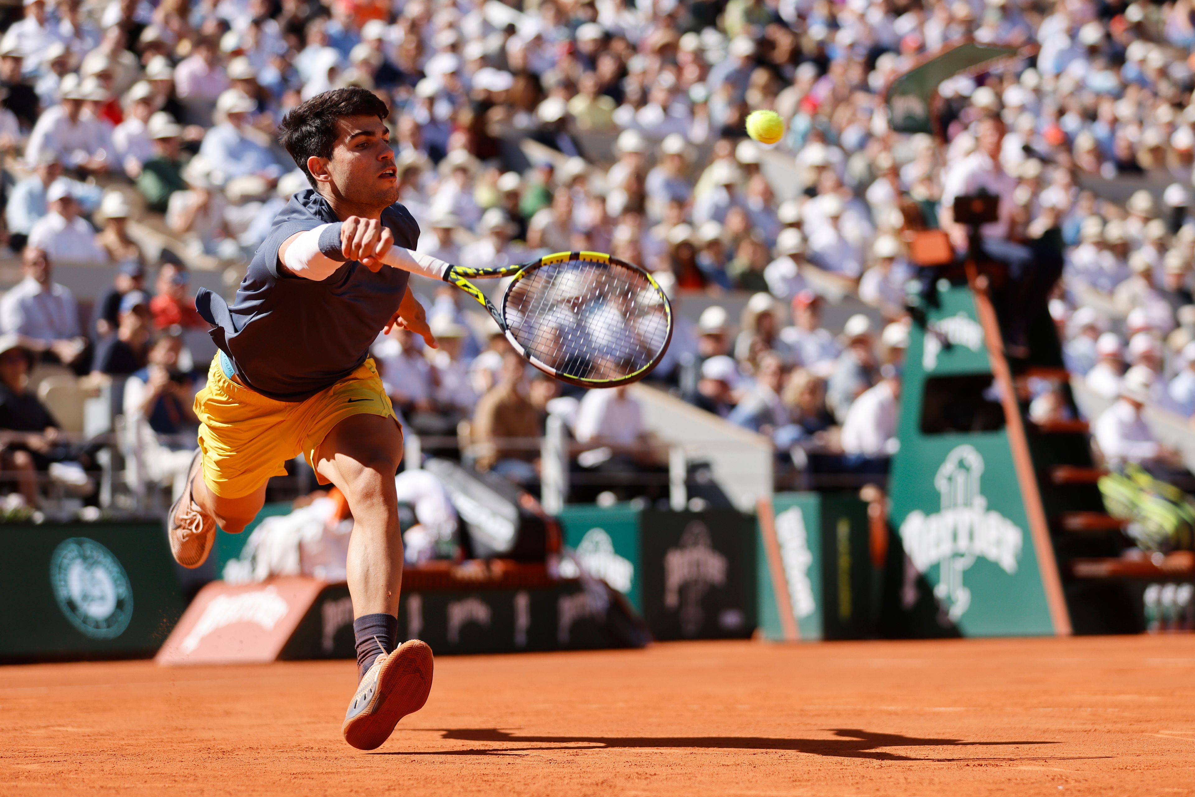 Spain's Carlos Alcaraz plays a shot against Italy's Jannik Sinner during their semifinal match of the French Open tennis tournament at the Roland Garros stadium in Paris, Friday, June 7, 2024.