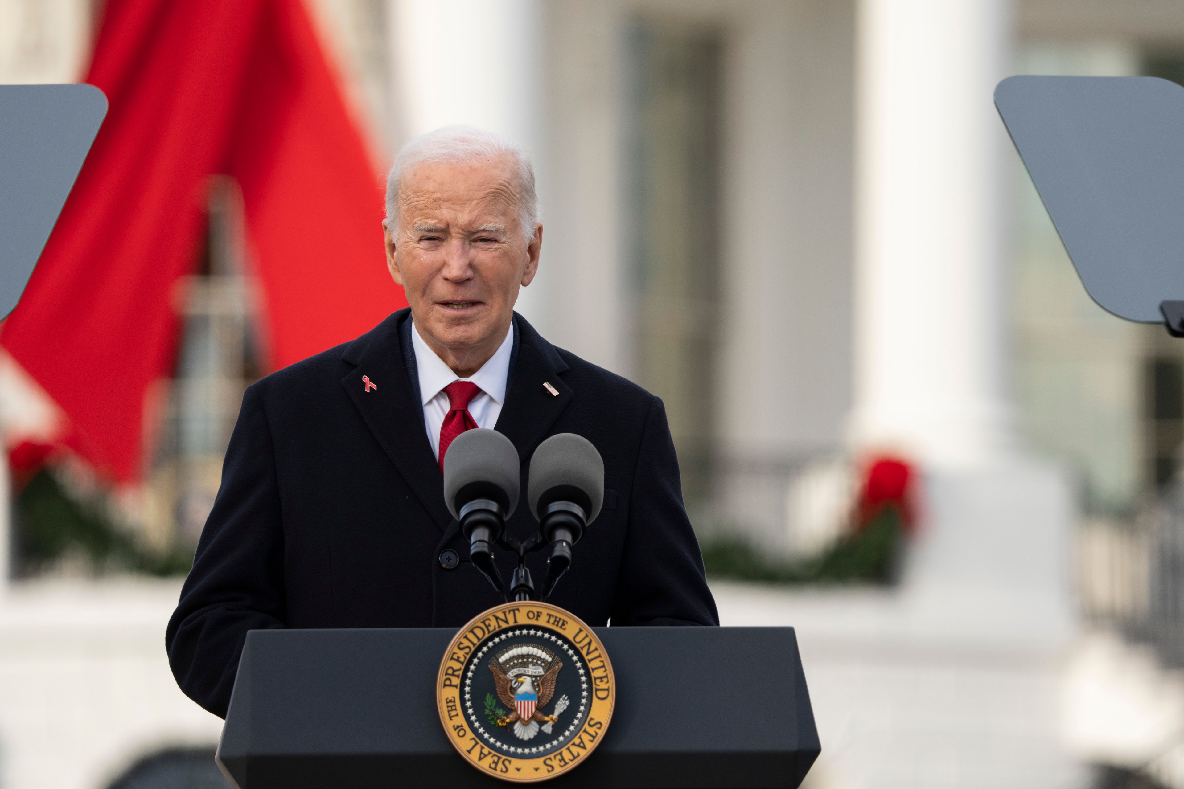 President Joe Biden speaks on the South Lawn of the White House during a ceremony to commemorate World AIDS Day with survivors, their families and advocates, Sunday, Dec. 1, 2024, in Washington. (AP Photo/Manuel Balce Ceneta)