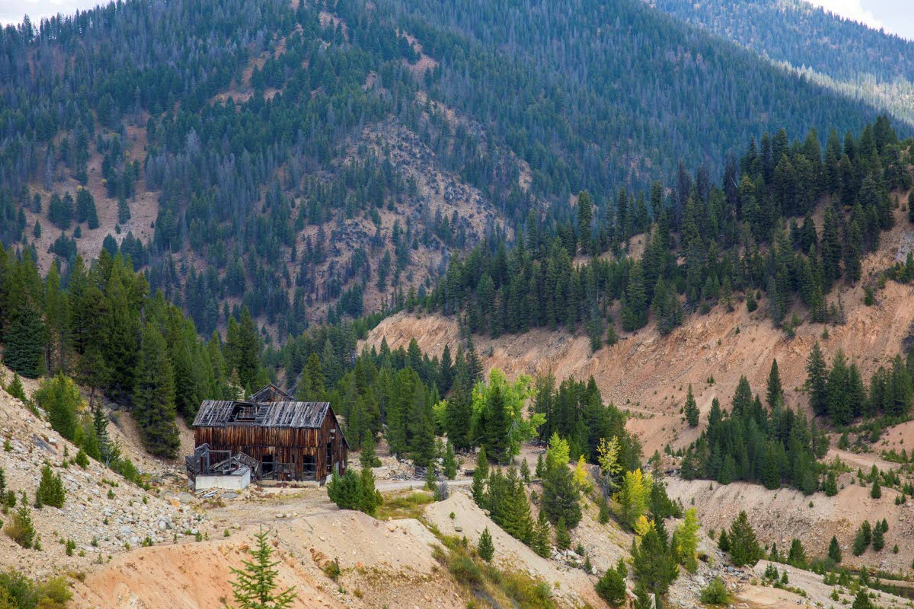 This Sept. 19, 2018, photo shows the last standing building above the Yellow Pine open-pit gold mine in the Stibnite Mining District in central Idaho.