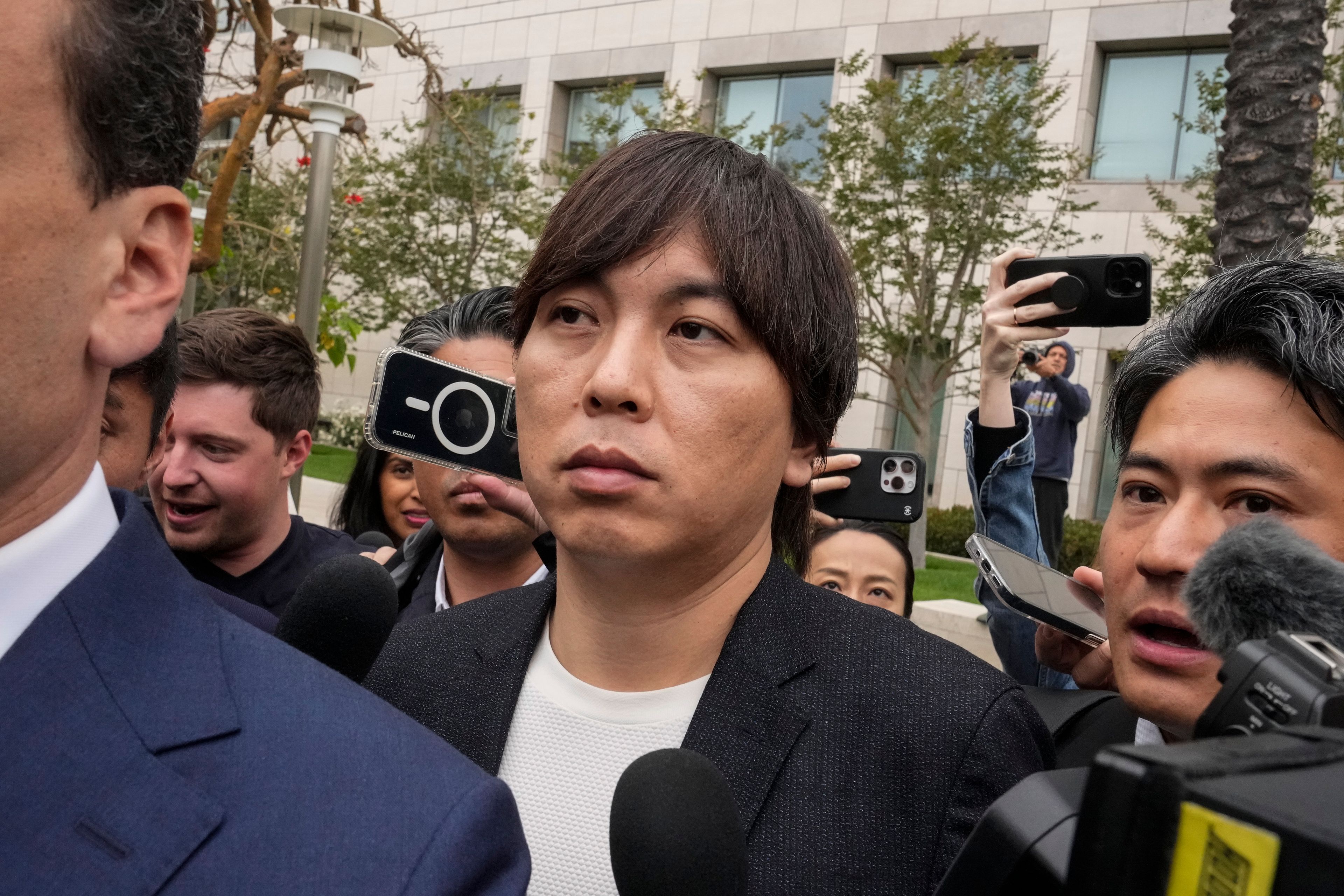 Ippei Mizuhara, the former interpreter for the Los Angeles Dodgers baseball star Shohei Ohtani, leaves federal court in Los Angeles, Tuesday, June 4, 2024, after pleading guilty to bank and tax fraud in a sports betting case.