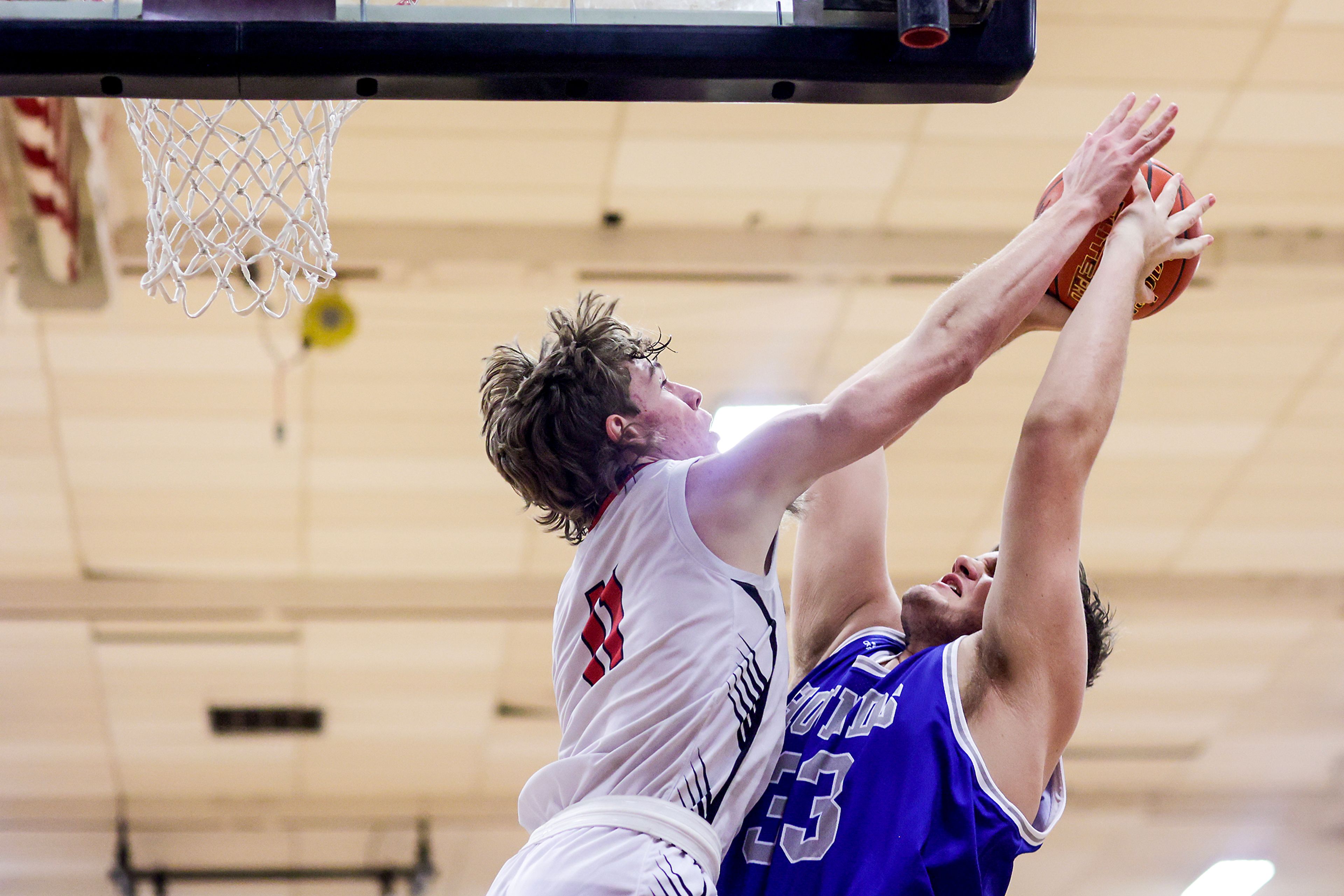 Pullman center Austin Hunt, right, looks to take a shot as Clarkston forward Dustin Beck defends during Tuesday's Class 2A Greater Spokane League boys basketball game.