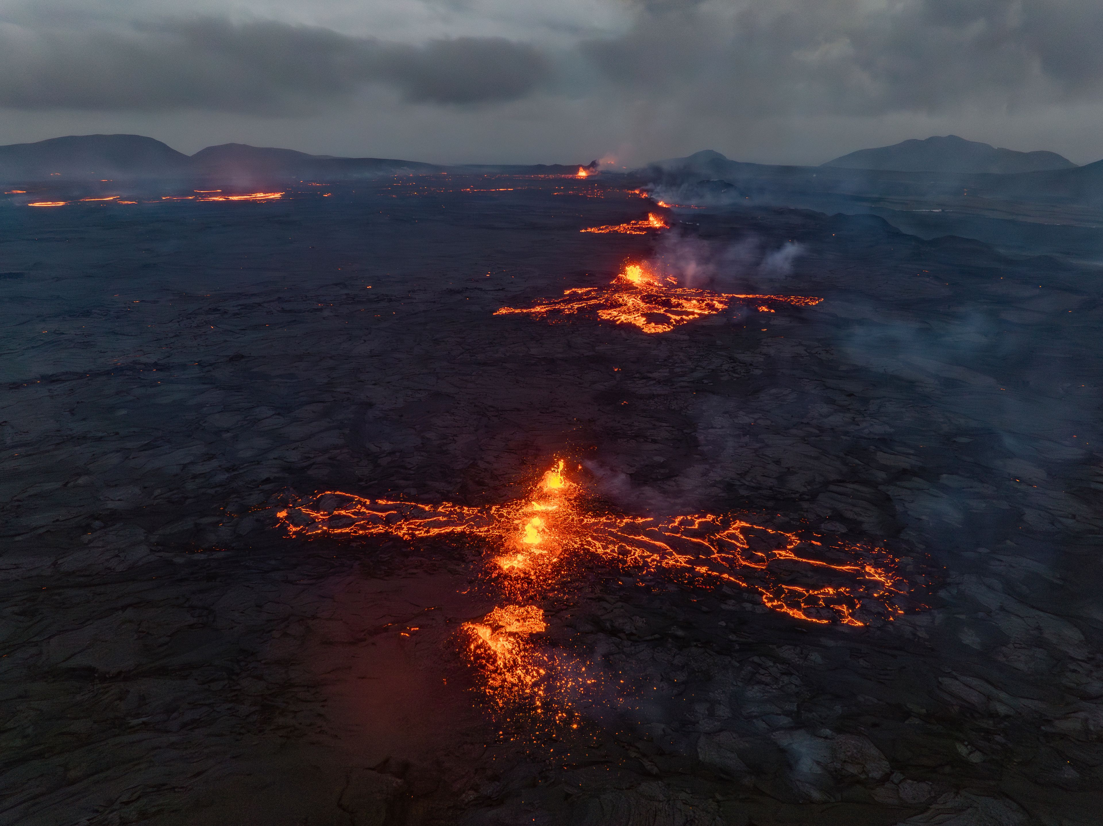 Eruptive fissures spew lava and smoke from a volcano in Grindavik, Iceland, Wednesday, May 29, 2024. A volcano in southwestern Iceland erupted Wednesday for the fifth time since December, spewing red lava that once again threatened the coastal town of Grindavik and led to the evacuation of the popular Blue Lagoon geothermal spa.