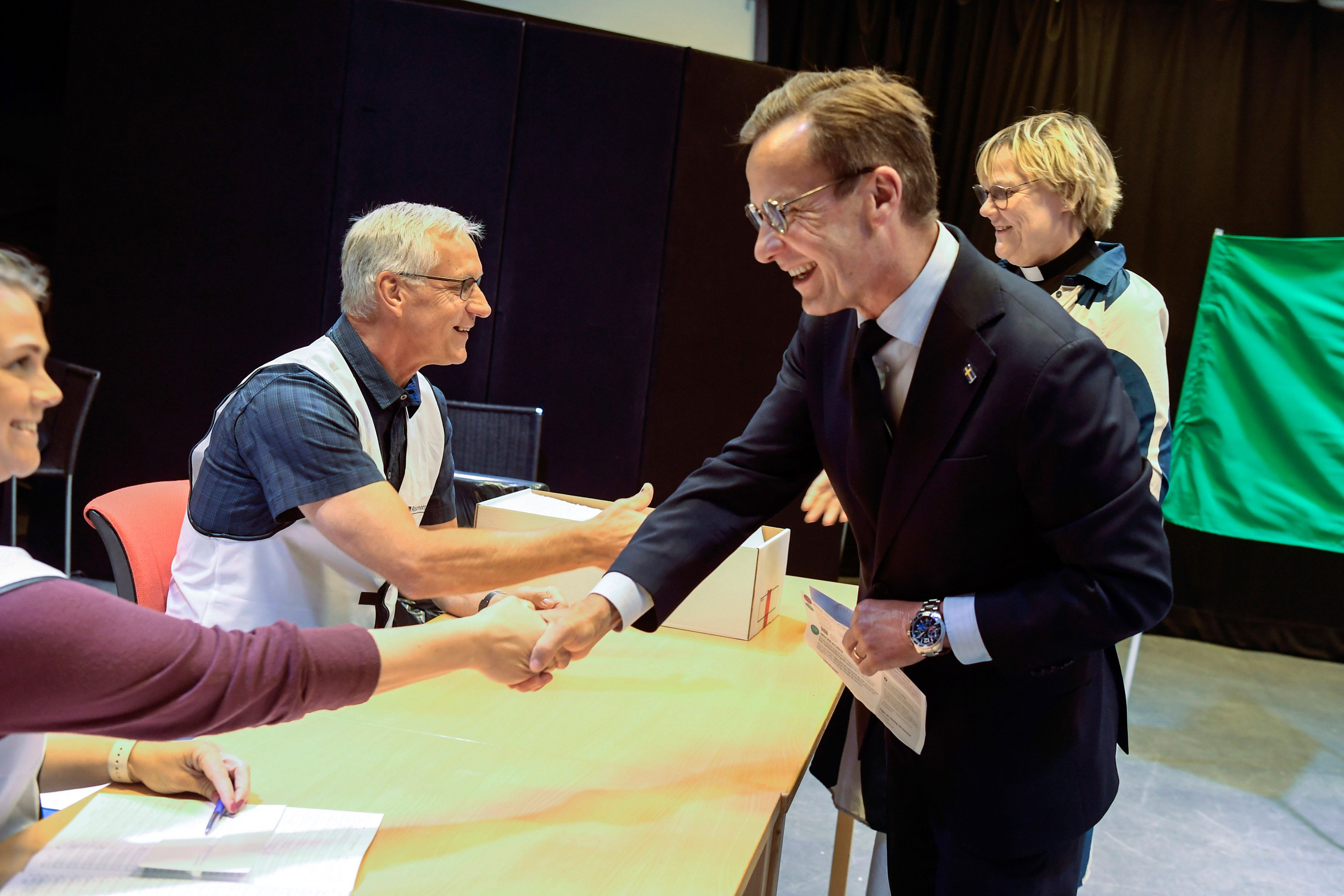 Sweden's Prime Minister Ulf Kristersson, centre right, and his wife Birgitta Ed, right, vote in the European Parliament election at a polling station in his hometown Strangnas, in Sweden, on Sunday June 9, 2024.