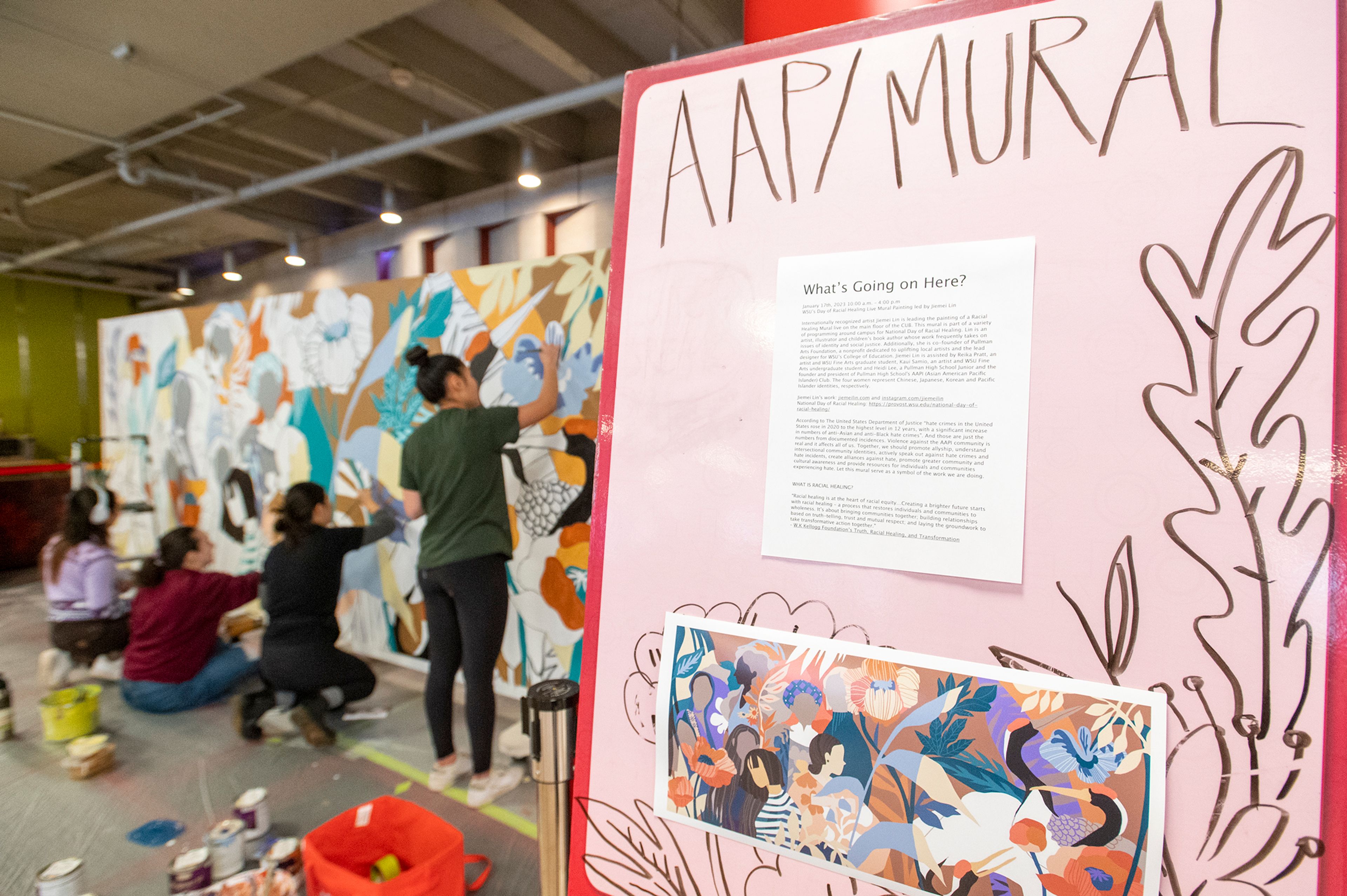 Artists Jiemei Lin, Reika Pratt, Kari Samio and Heidi Lee paint a mural Tuesday at Washington State University’s Compton Union Building in Pullman for the National Day of Racial Healing.