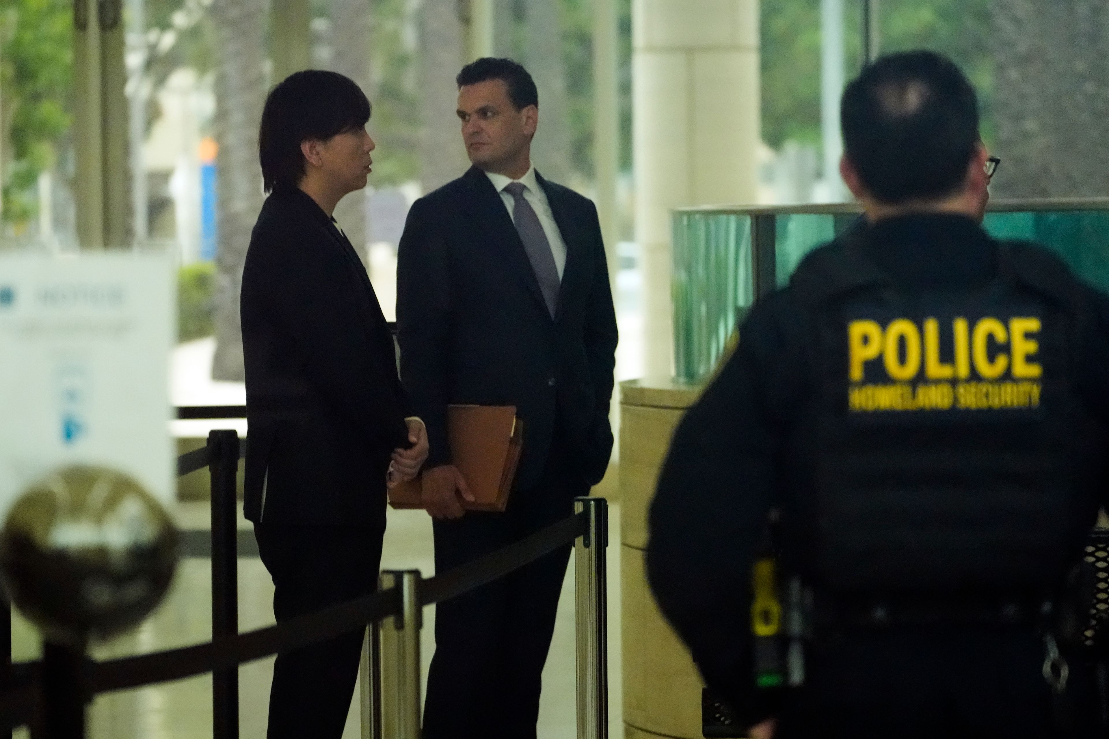 Ippei Mizuhara, left, the former interpreter for the Los Angeles Dodgers baseball star Shohei Ohtani, arrives at federal court with his defense attorney, Michael Freedman, Tuesday, June 4, 2024, in Los Angeles. Mizuhara pleaded guilty to bank and tax fraud on Tuesday and admitted to stealing nearly $17 million from the Japanese baseball player to pay off sports betting debts.