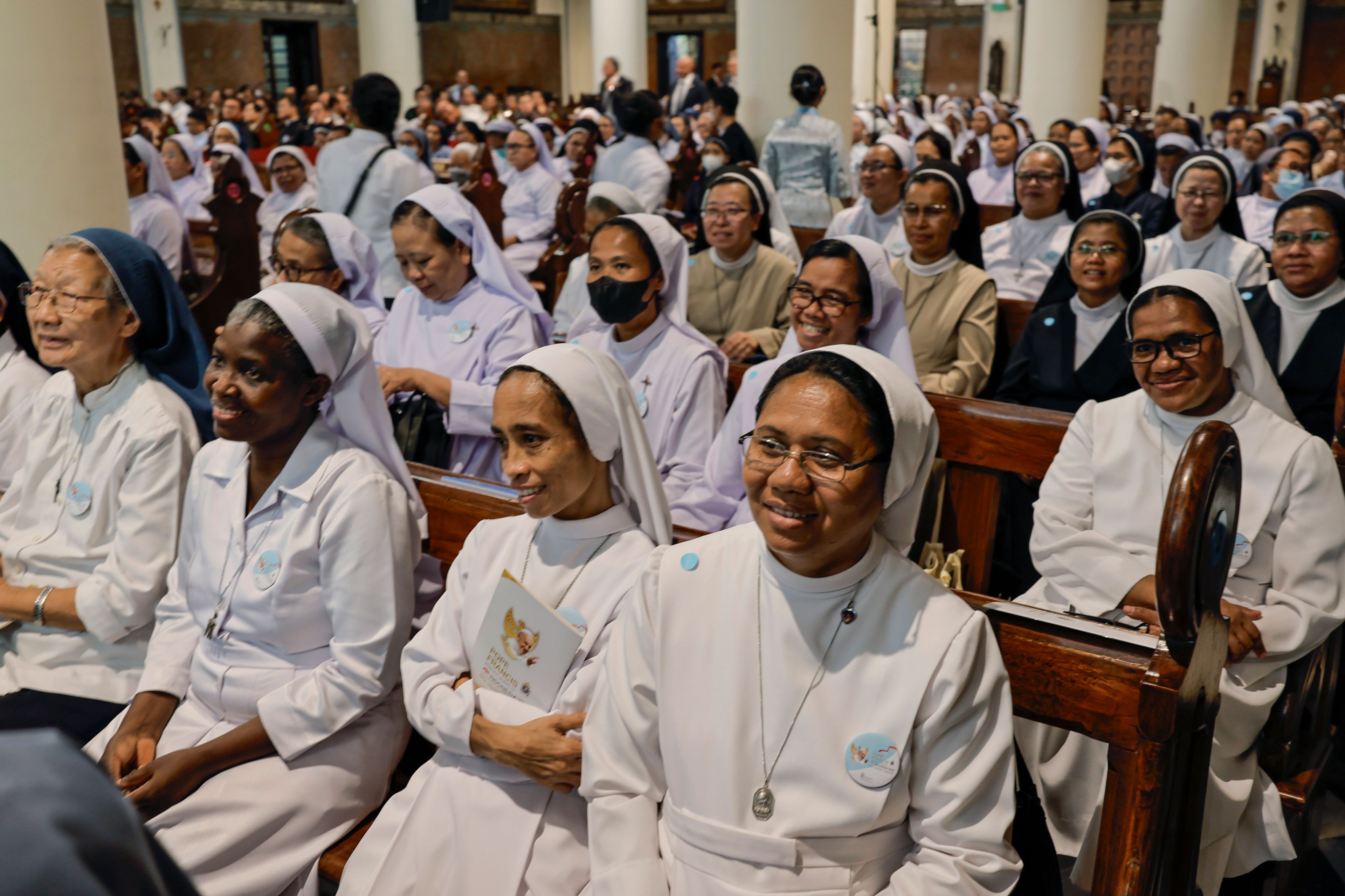 Nuns wait for the arrival of Pope Francis at the Cathedral of Our Lady of the Assumption in Jakarta Wednesday, Sept. 4, 2024.