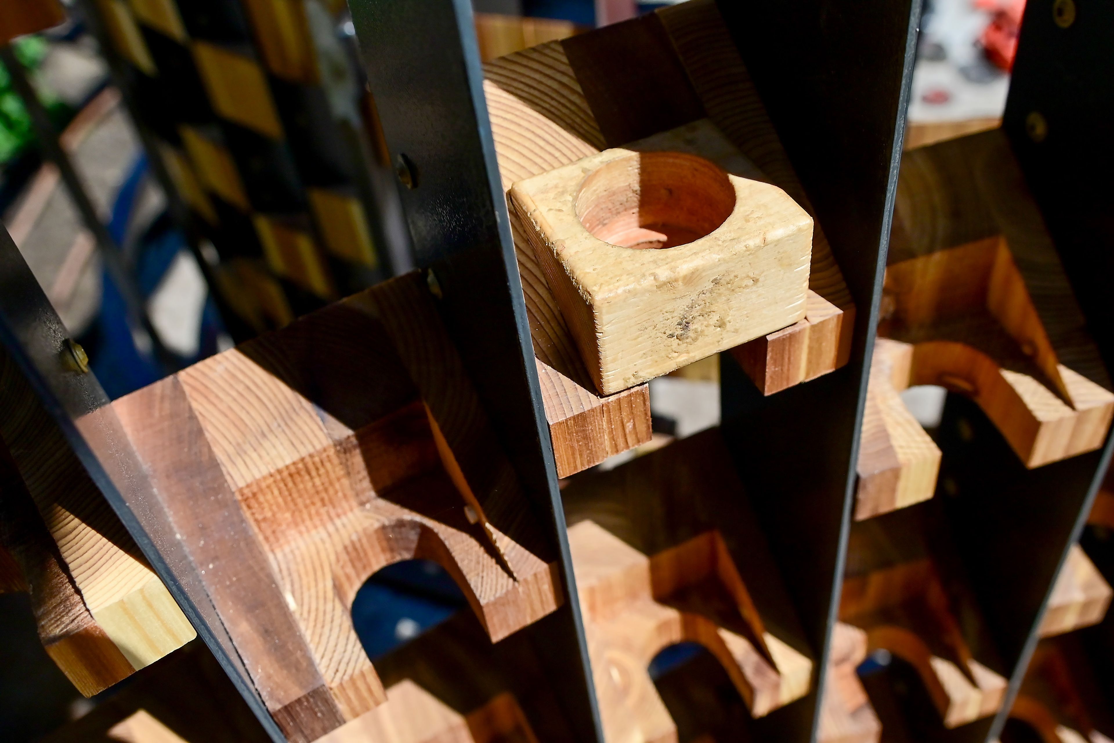 Spots along the walls of the sitting areas of the Vandal Healing Garden and Memorial are designed to hold a block for leaving behind candles and messages.