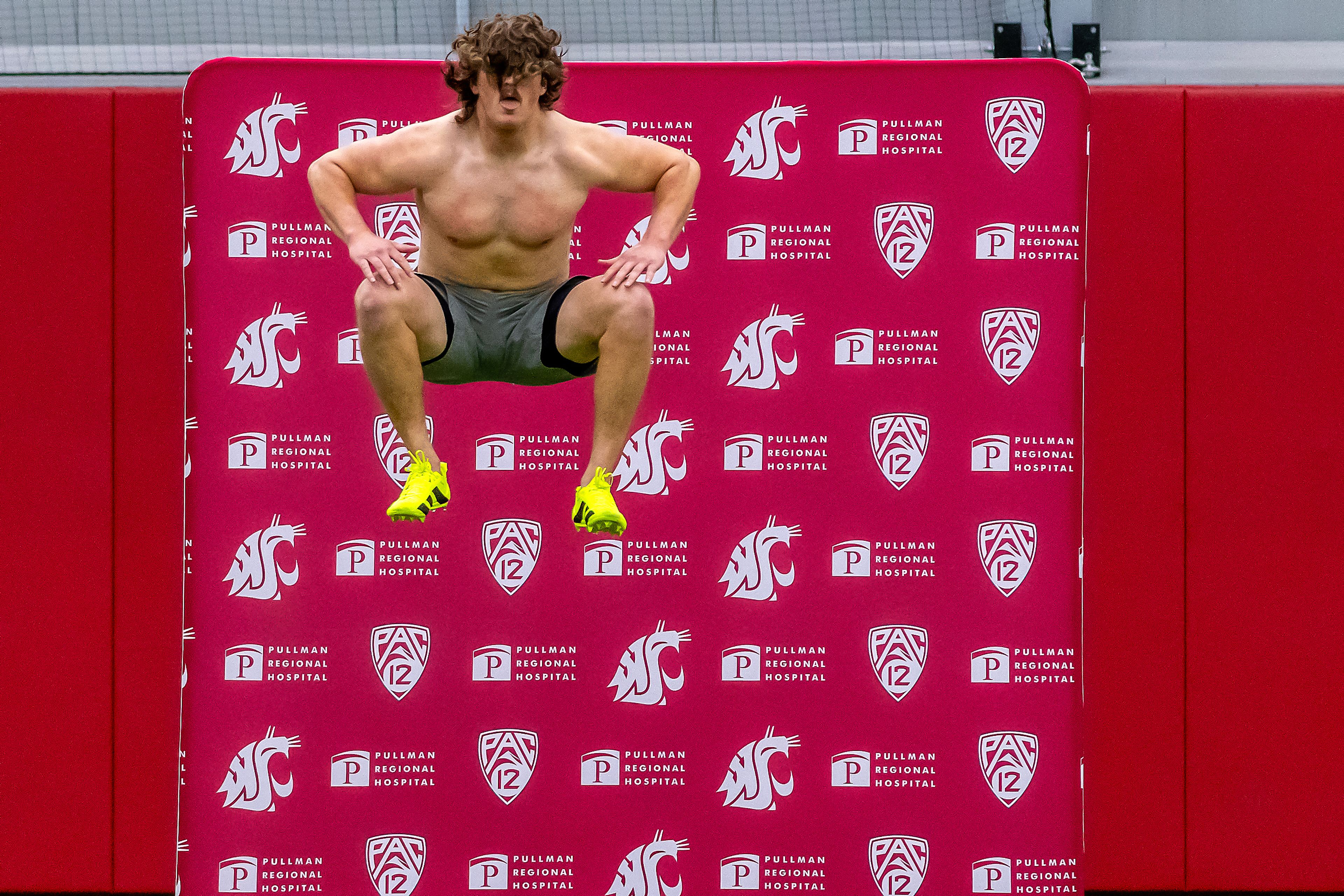 Washington State defensive end Andrew Edson leaps into the air before the 40-yard dash during WSU's Pro Day on Friday in Pullman.