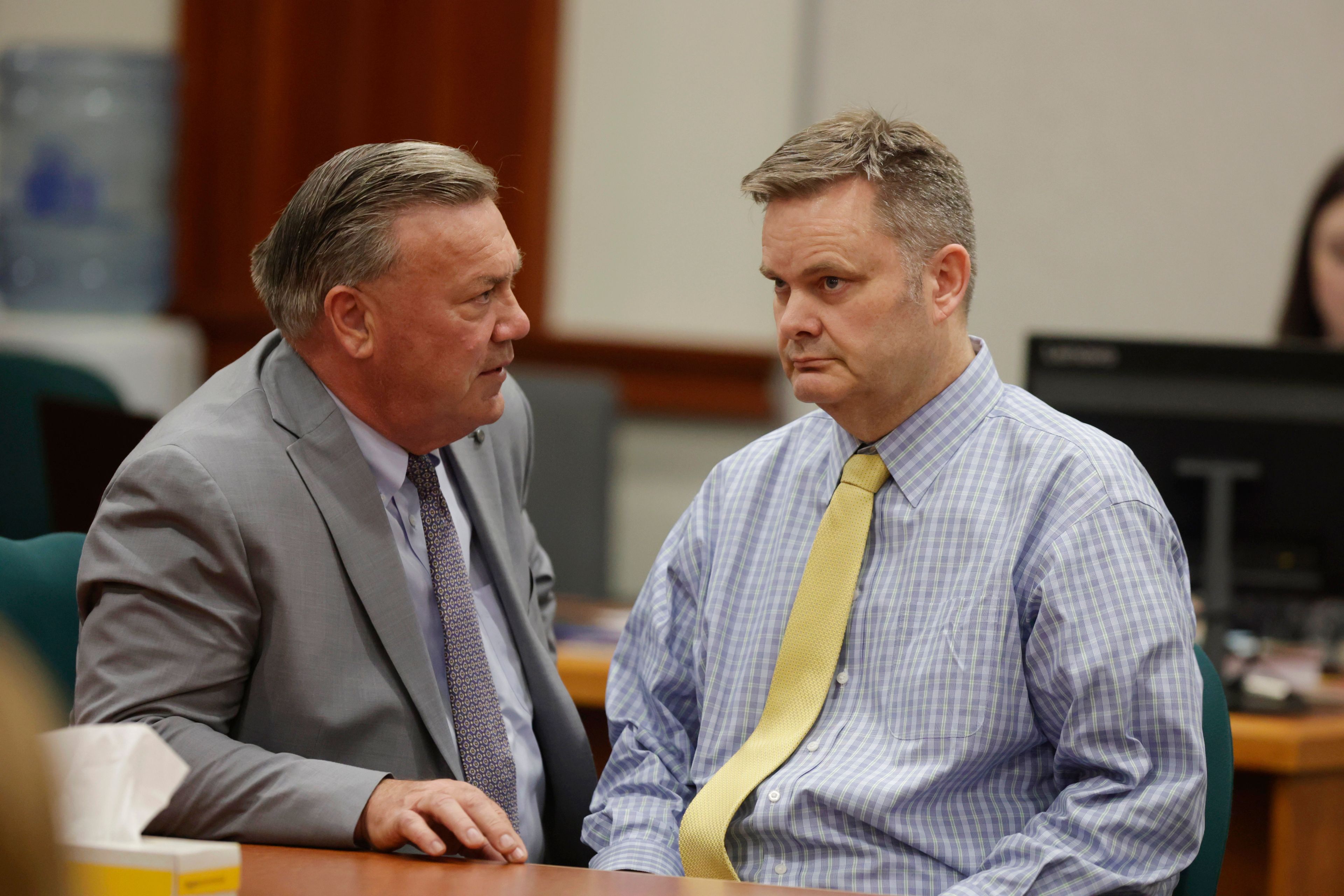 Chad Daybell, right, talks with defense lawyer John Prior before his verdict was read his in his murder trial at the Ada County Courthouse in Boise, Idaho, on Thursday, May 30, 2024. Daybell was convicted of killing his wife and his new girlfriend's two youngest kids in a strange triple murder case that included claims of apocalyptic prophesies, zombie children and illicit affairs. (AP Photo/Kyle Green, Pool)