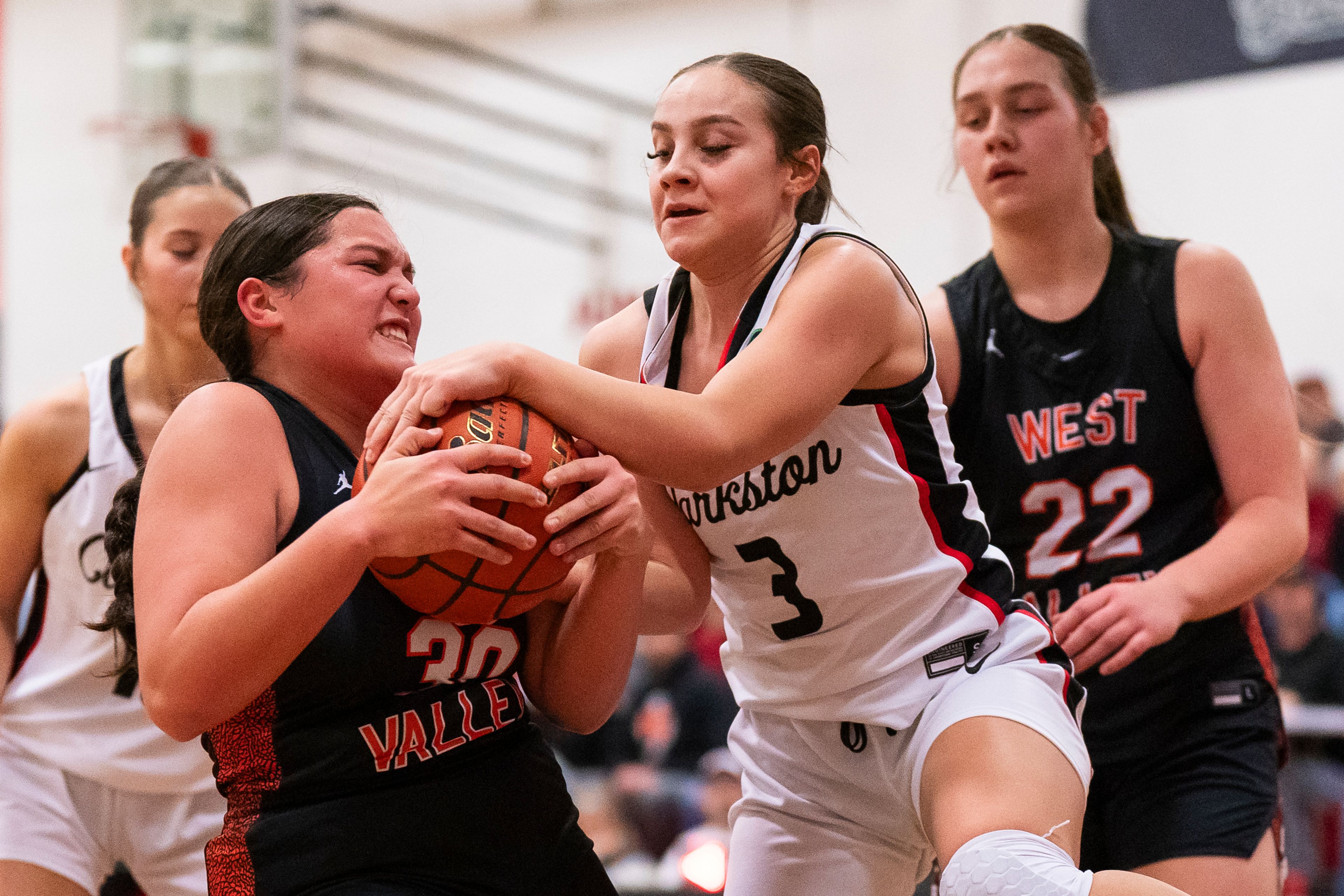 Clarkston’s Kendall Wallace (3) fights for a loose ball during their game against West Valley on Tuesday at Clarkston High School.