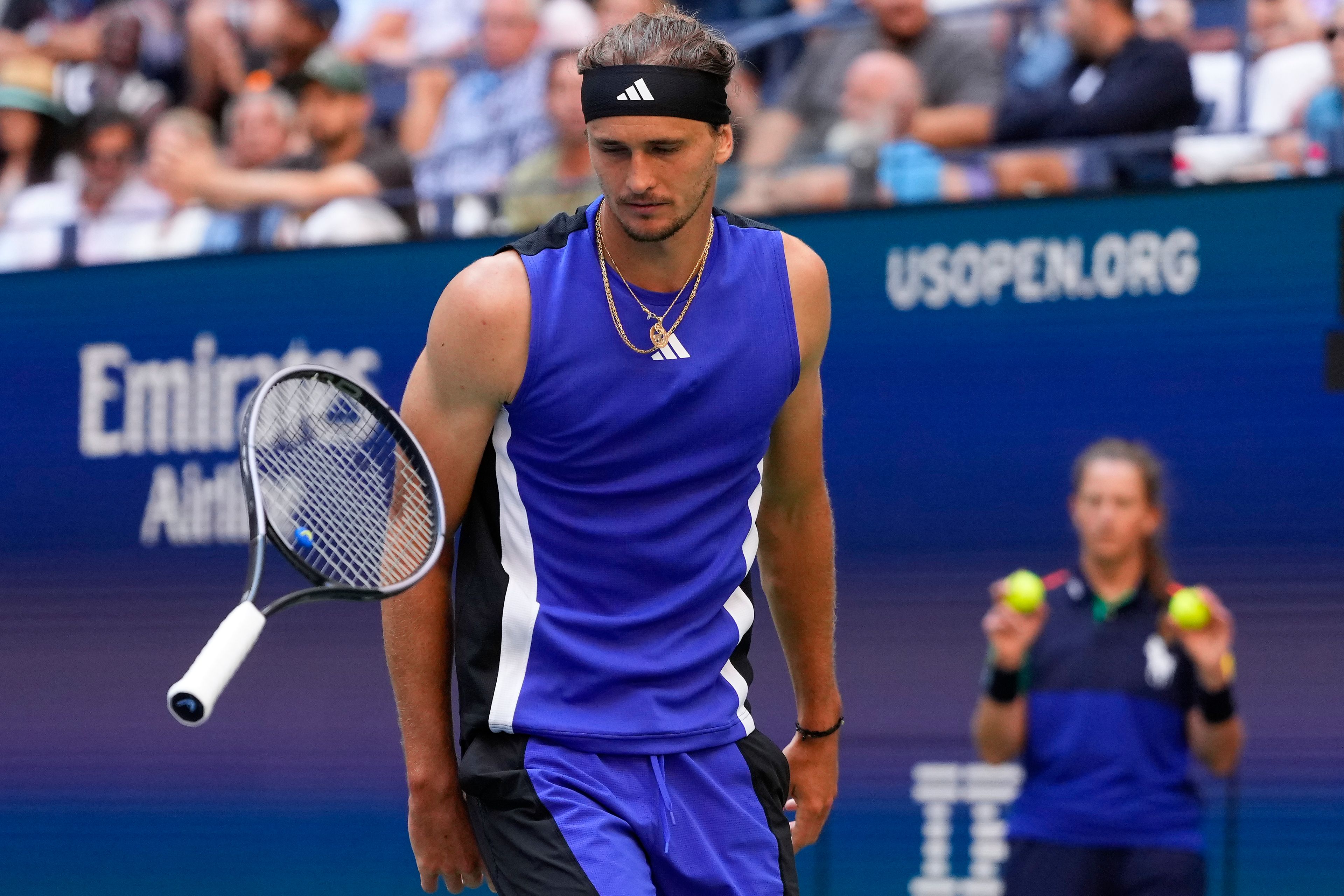 Alexander Zverev, of Germany, bounces his racket off the court in the fourth set against Taylor Fritz, of the United States, during the quarterfinals of the U.S. Open tennis championships, Tuesday, Sept. 3, 2024, in New York.