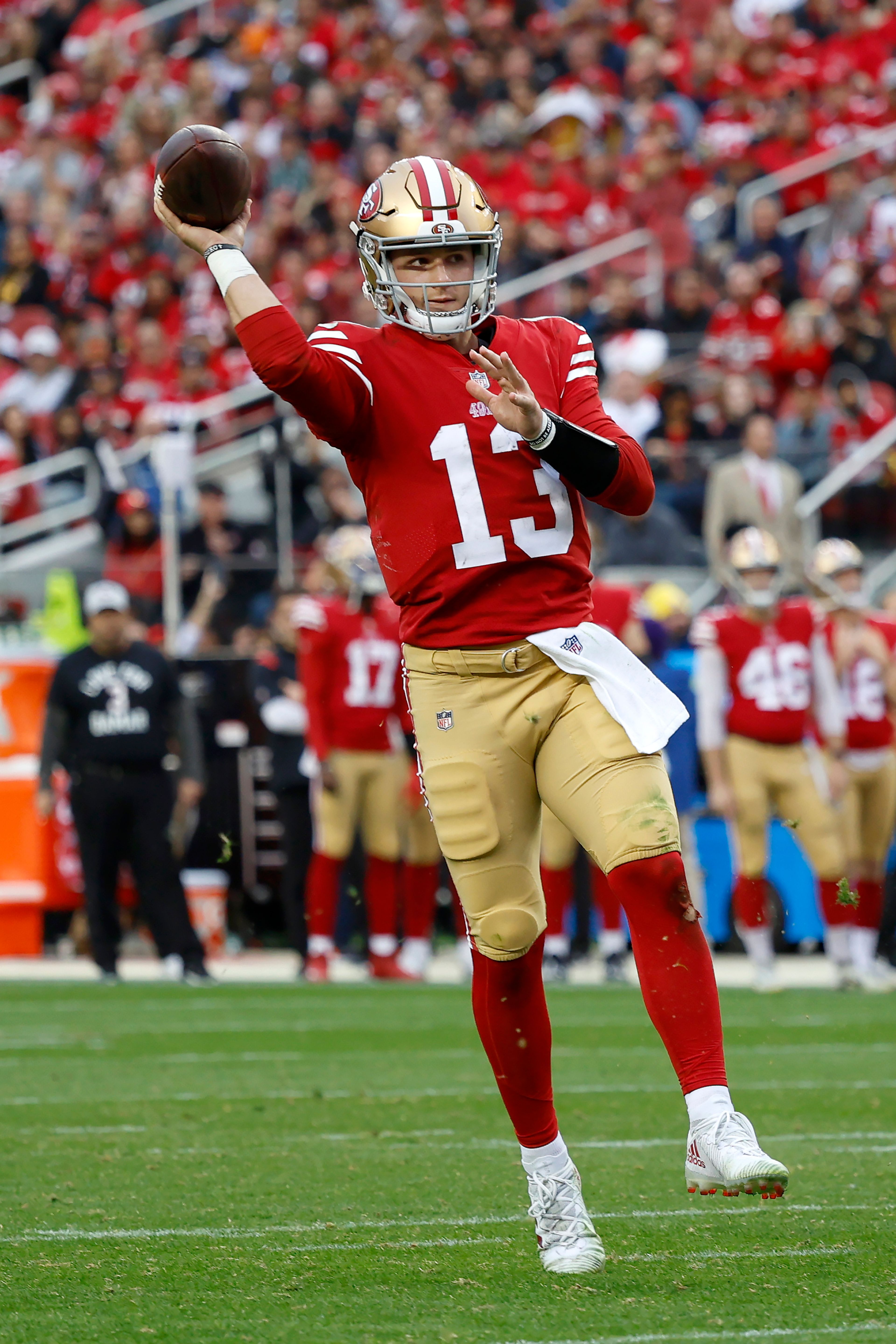 San Francisco 49ers quarterback Brock Purdy (13) throws a touchdown pass during the second half of an NFL football game against the Arizona Cardinals in Santa Clara, Calif., Sunday, Jan. 8, 2023. (AP Photo/Jed Jacobsohn)