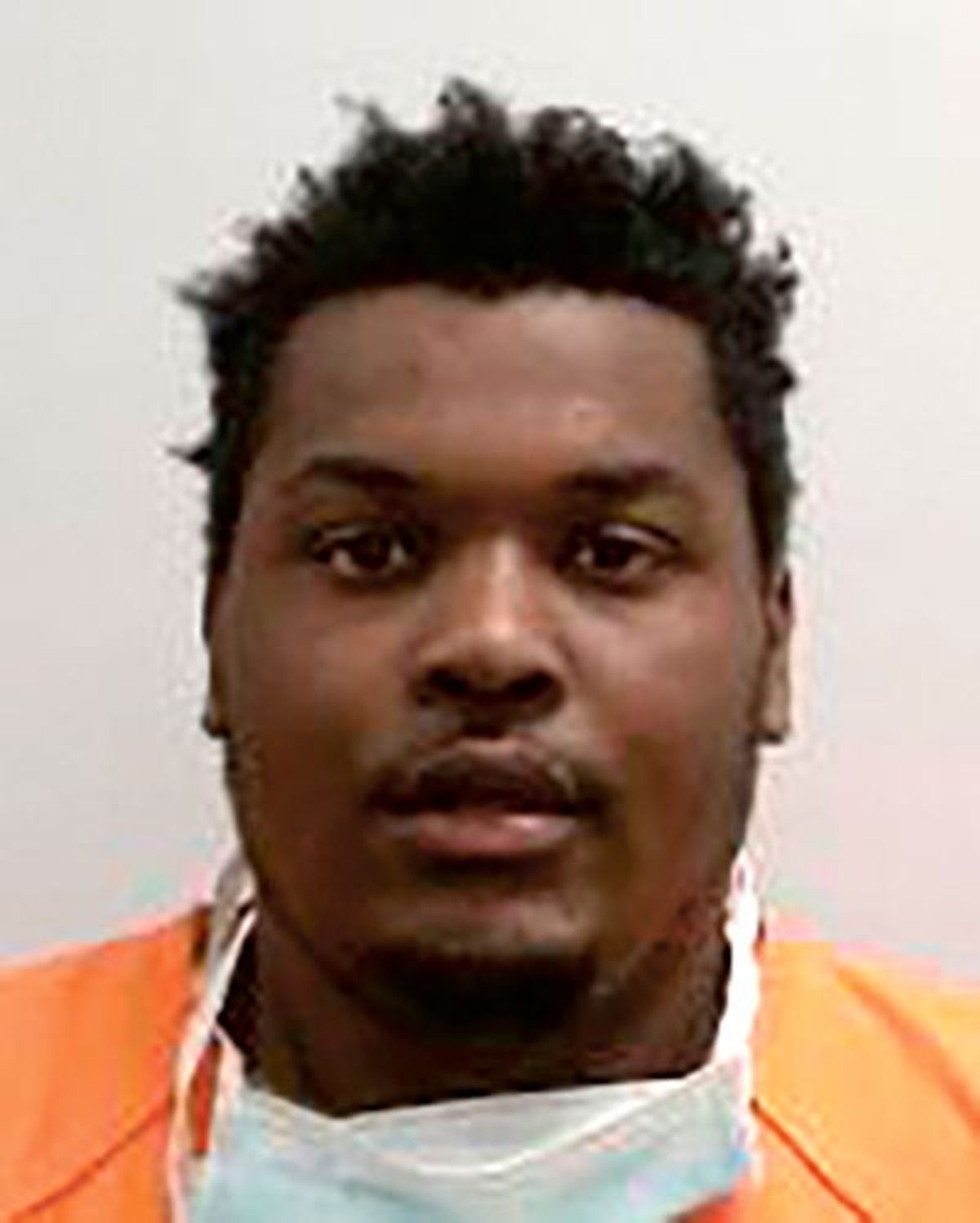 Man charged with robbing three men at gunpoint