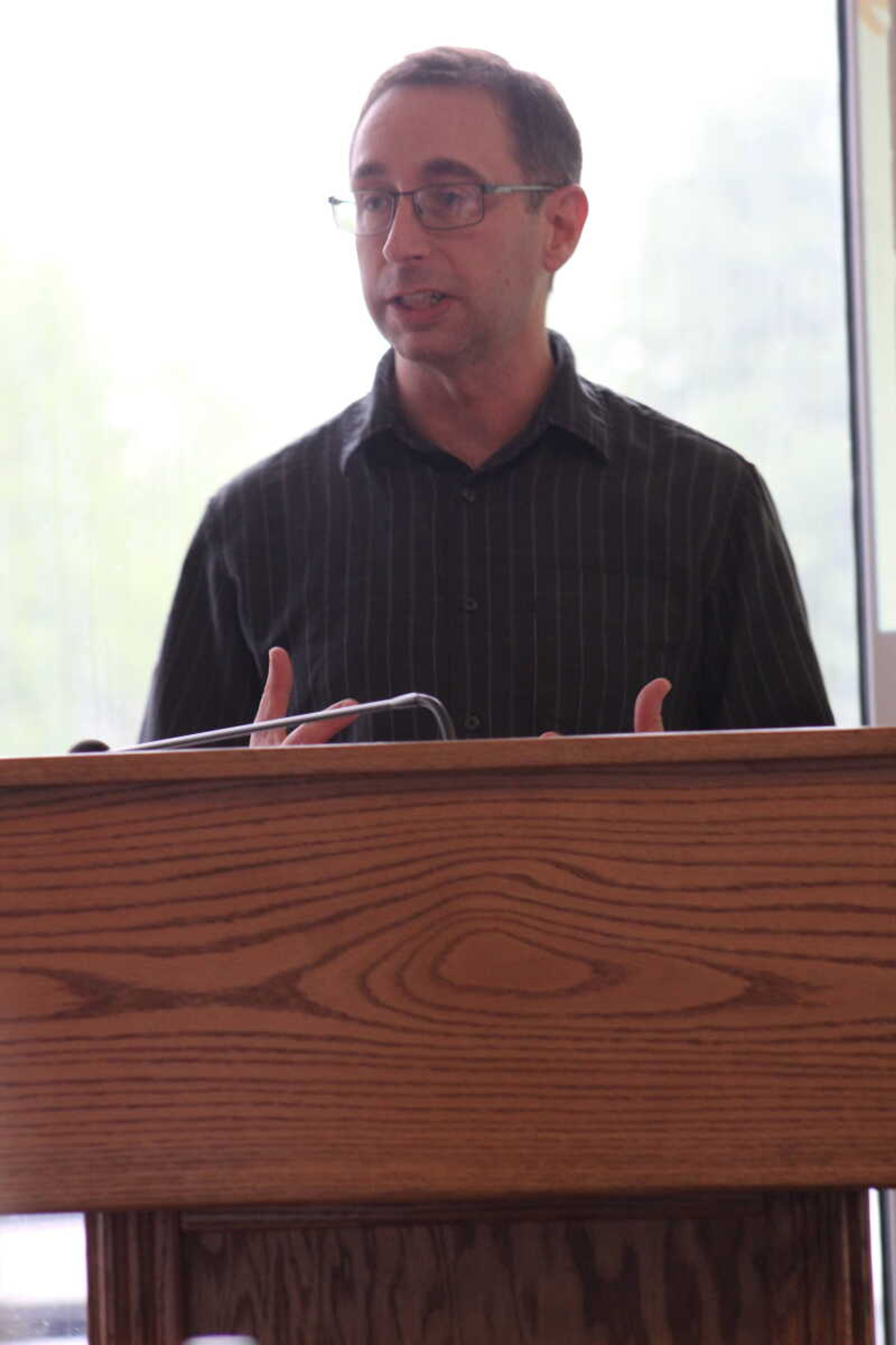 Pastor Mike Williams welcomed everyone to the National Day of Prayer and spoke about the event's history and the services the Ministerial Alliance provides.