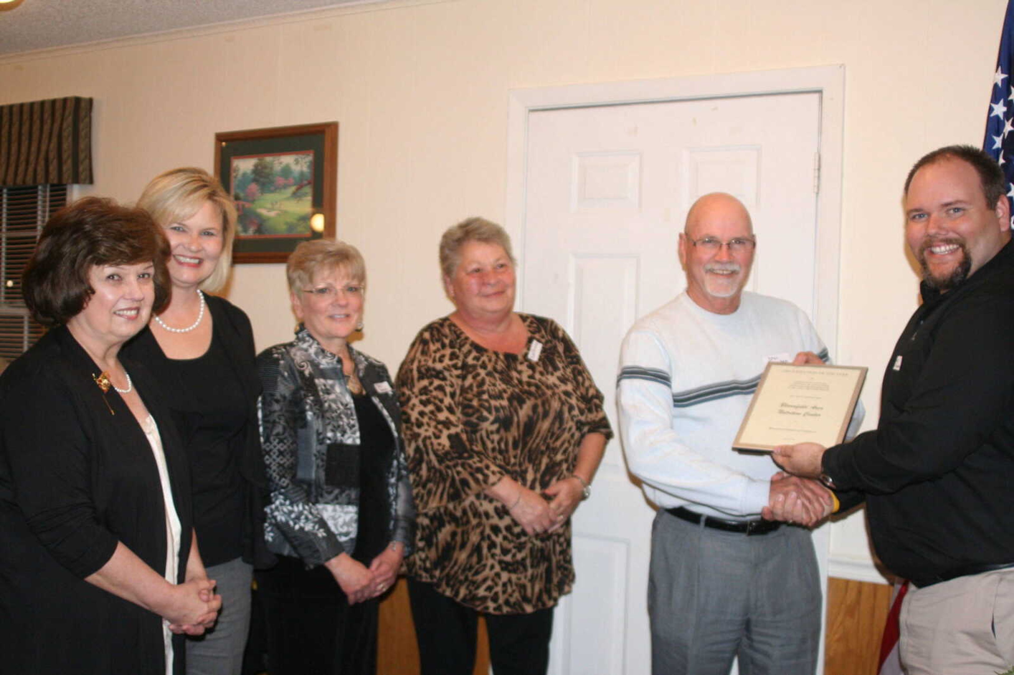 Members of the Bloomfield Area Nutrition Center accept the Organization of the Year award from Brock Williams at the 2011 Bloomfield Chamber of Commerce Awards Banquet.