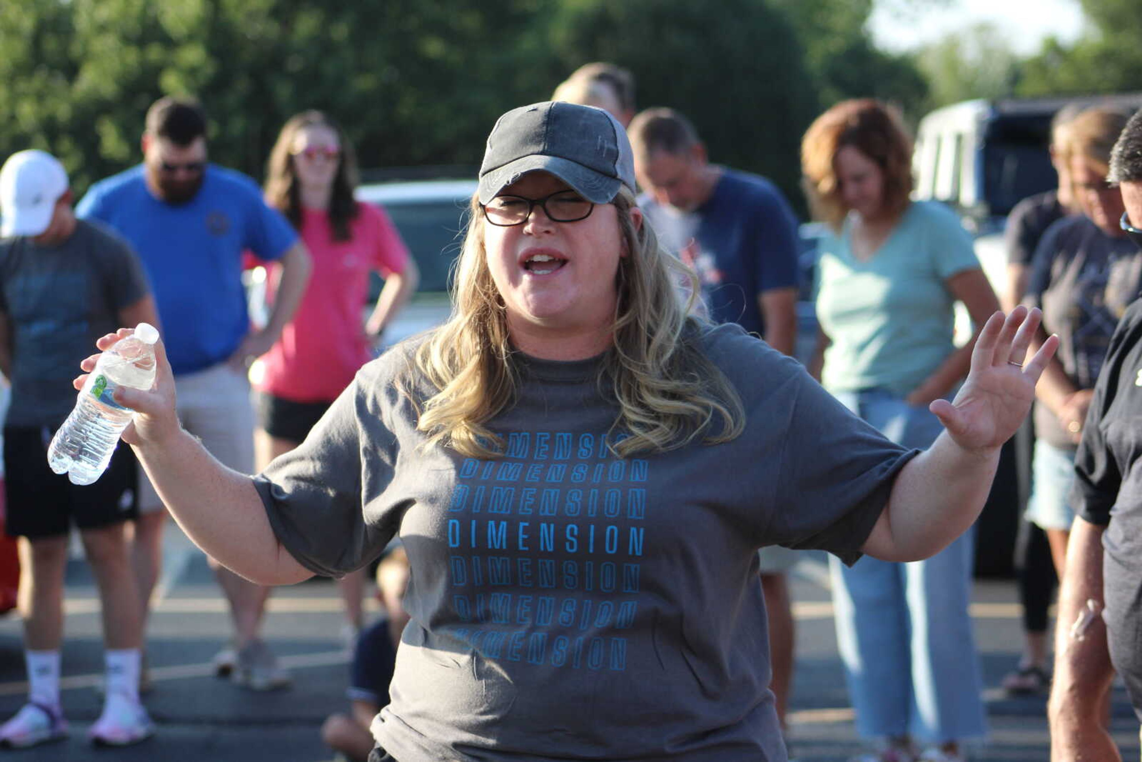 Youth Pastor at Dimension Church, Kerri Cole, leads a prayer at the Prayer Walk.