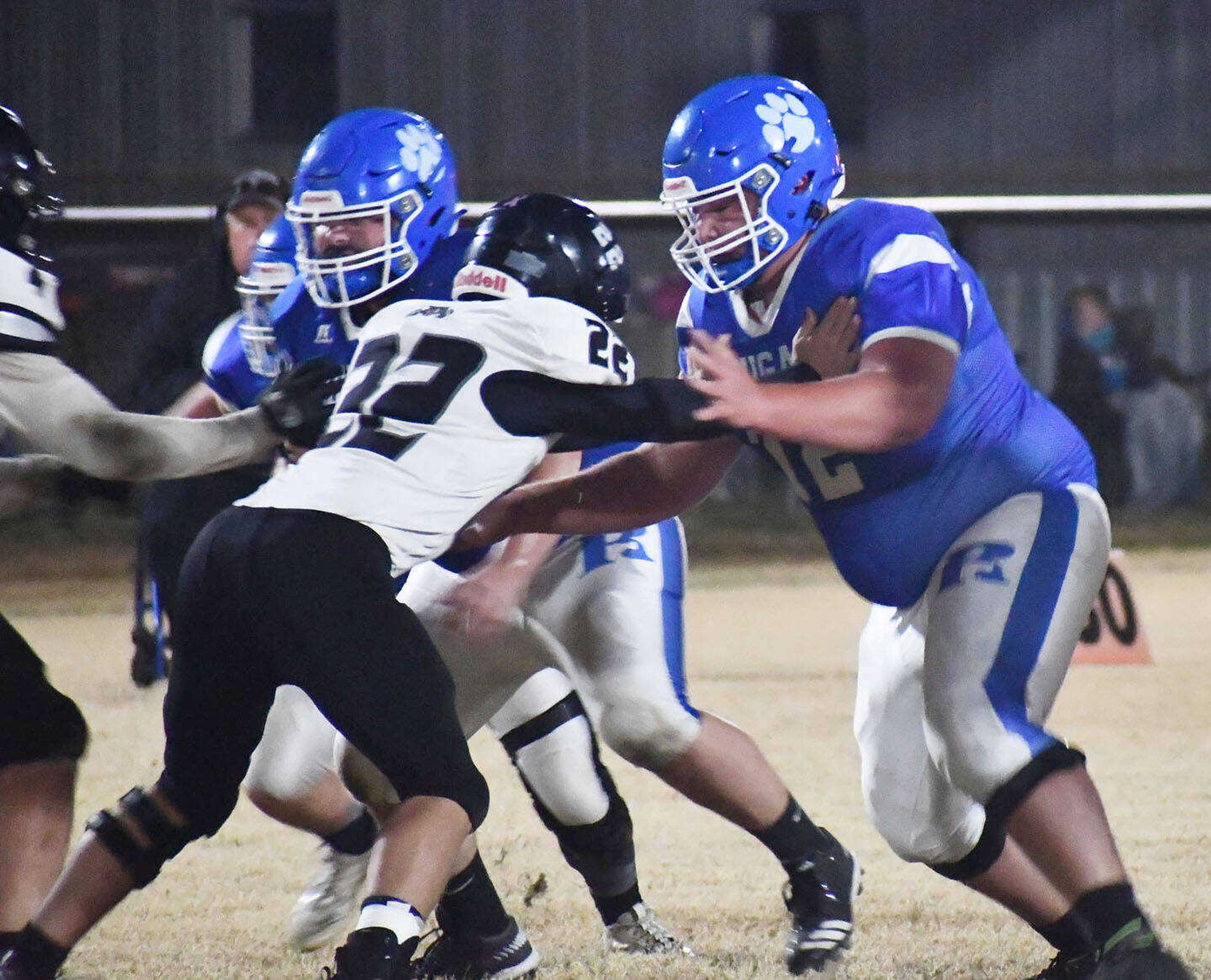 Rector’s Gabe Mosley (72) engages at the point of attack during an Arkansas 8-man semifinal game versus Izard County dated Friday, Nov. 17, 2023, in Rector, Ark. Offensive lines in 8-man football typically feature three linemen plus a tight end.