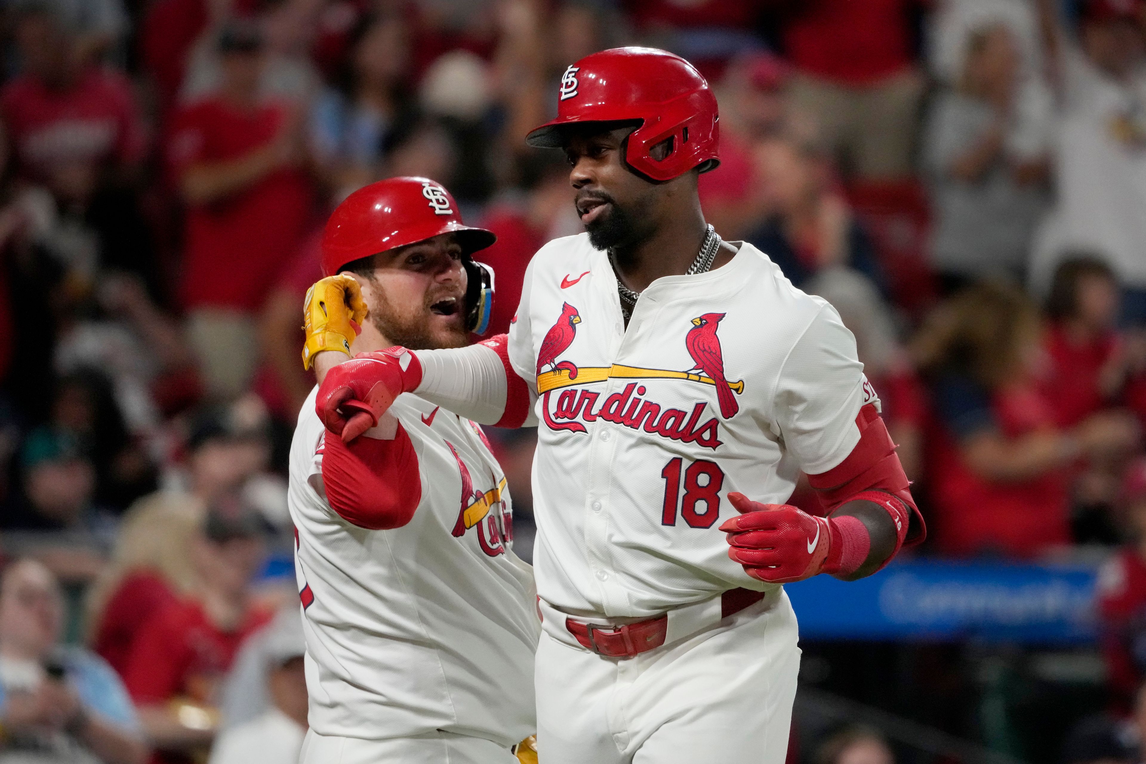 St. Louis Cardinals' Jordan Walker (18) is congratulated by teammate Pedro Pages after hitting a solo home run during the seventh inning of a baseball game against the Seattle Mariners Friday, Sept. 6, 2024, in St. Louis. (AP Photo/Jeff Roberson)