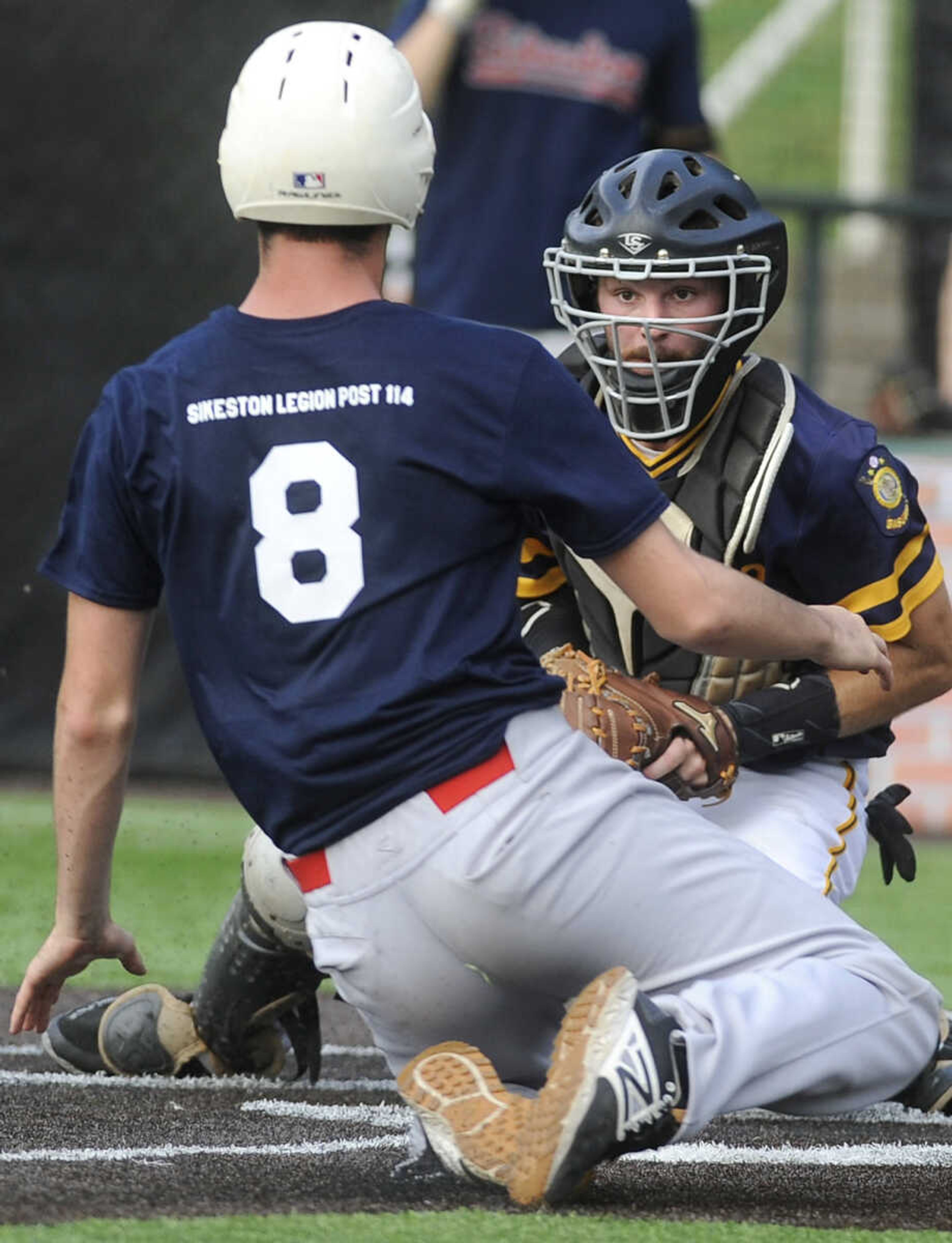 FRED LYNCH ~ flynch@semissourian.com
Cape Girardeau Post 63 catcher Derrick Kirn waits to tag out Sikeston's Clark Steward during the second inning of the first game Wednesday, June 20, 2018 at Capaha Field.