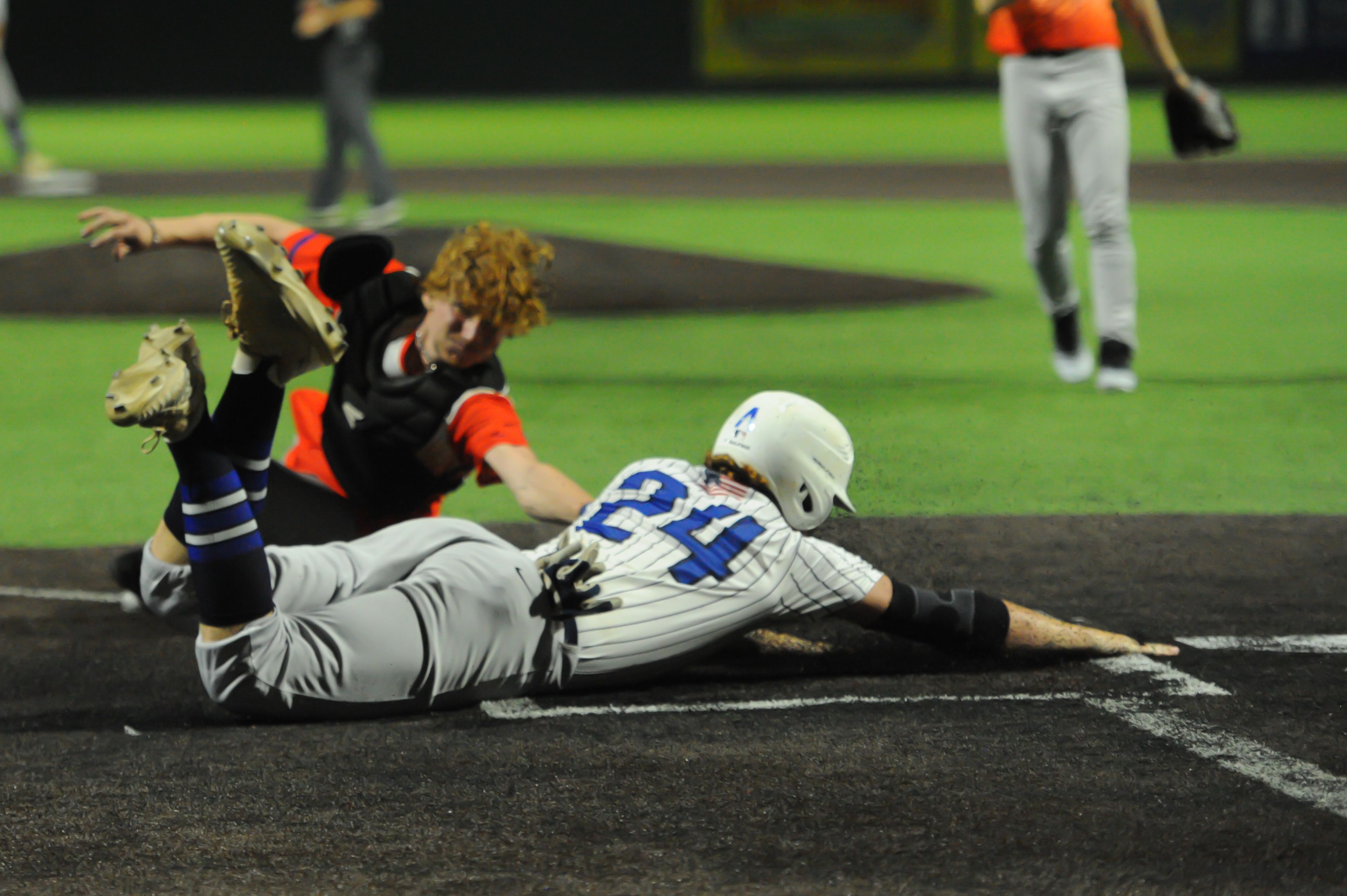 Aycorp's Luke Hester slides around a tag during a Tuesday, August 13, 2024 Babe Ruth World Series game between the Aycorp Fighting Squirrels and Holland Henson of the Netherlands at Capaha Field in Cape Girardeau, Mo. Aycorp defeated the Netherlands, 12-2 in five innings.