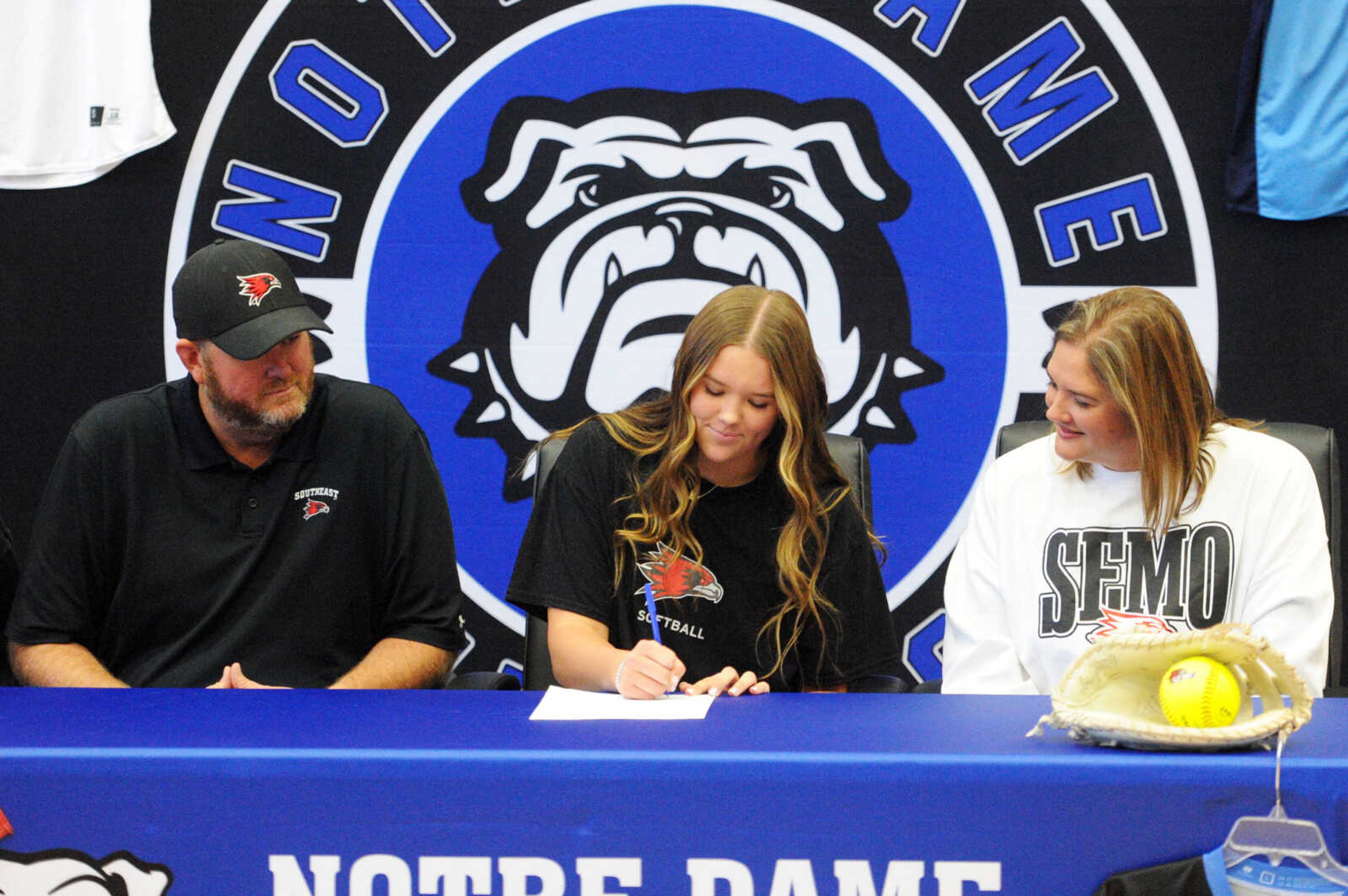 Notre Dame's Hailey Burnett signs a letter of intent to play softball at Southeast Missouri State on Monday at Notre Dame Regional High School.