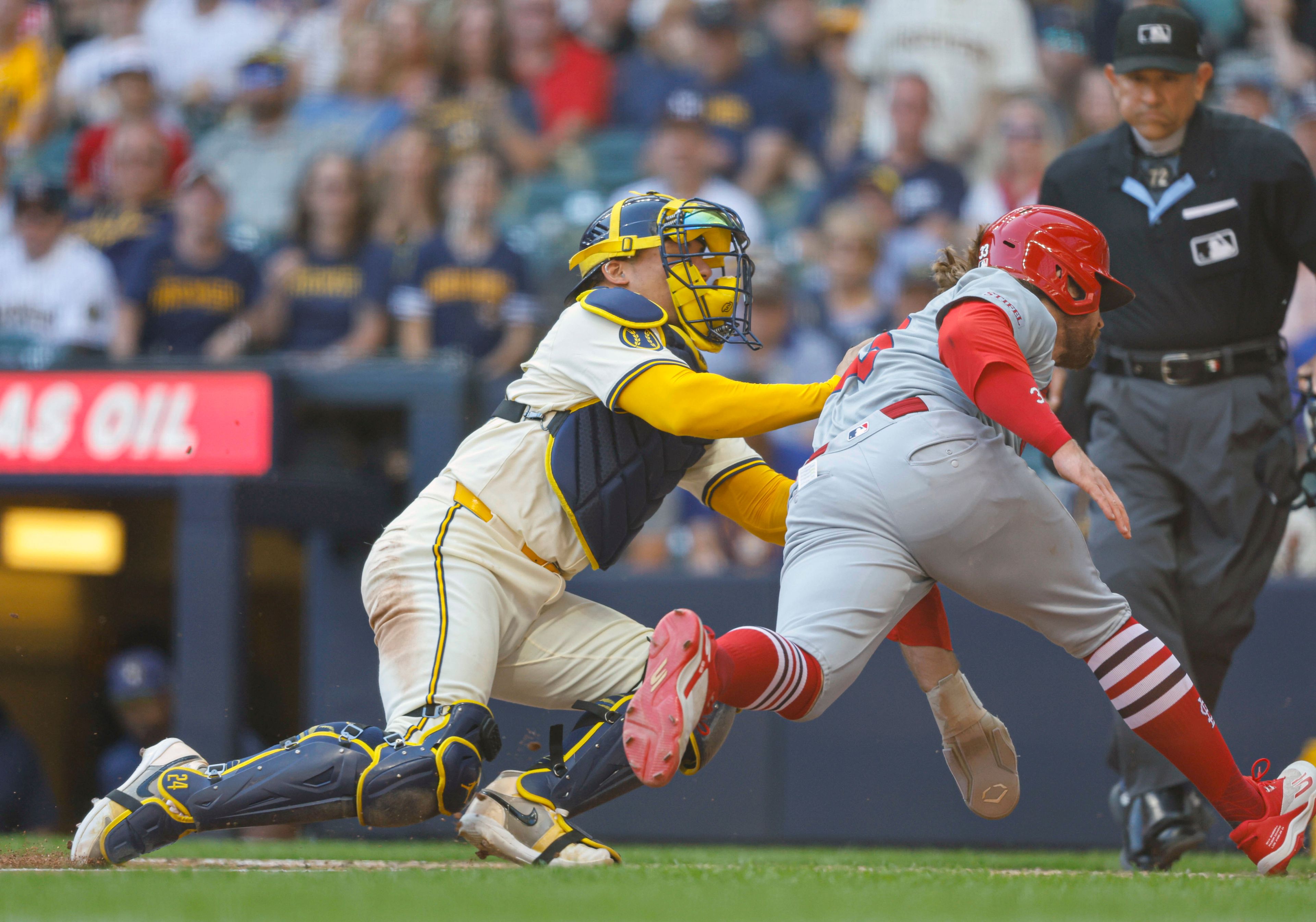 St. Louis Cardinals' Brendan Donovan (33) is tagged out by Milwaukee Brewers catcher William Contreras during the fourth inning of a baseball game, Monday, Sept. 2, 2024, in Milwaukee. (AP Photo/Jeffrey Phelps)