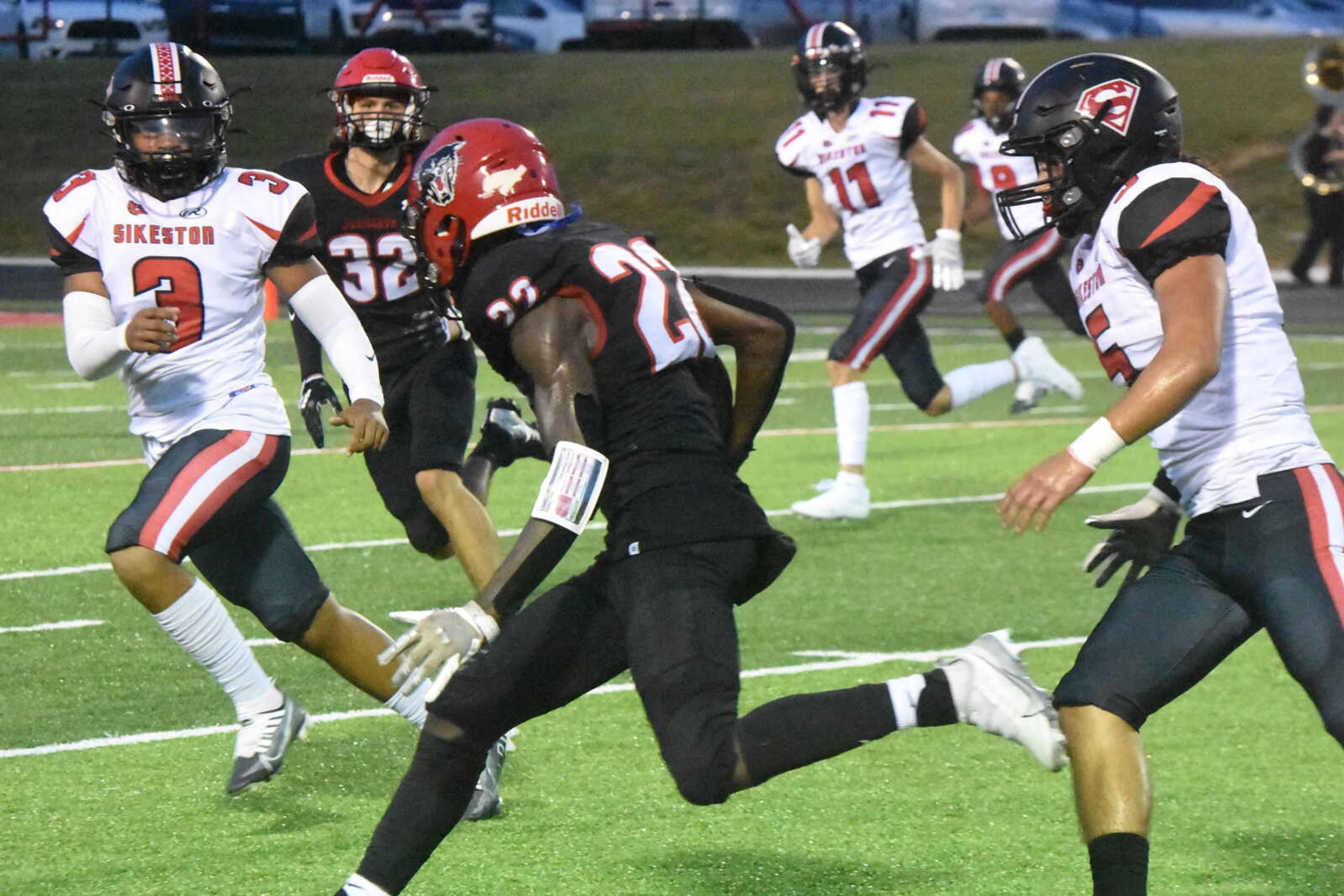 Dexter's Jaxen Grams (22) runs throungh the Sikeston secondary after catching a pass.