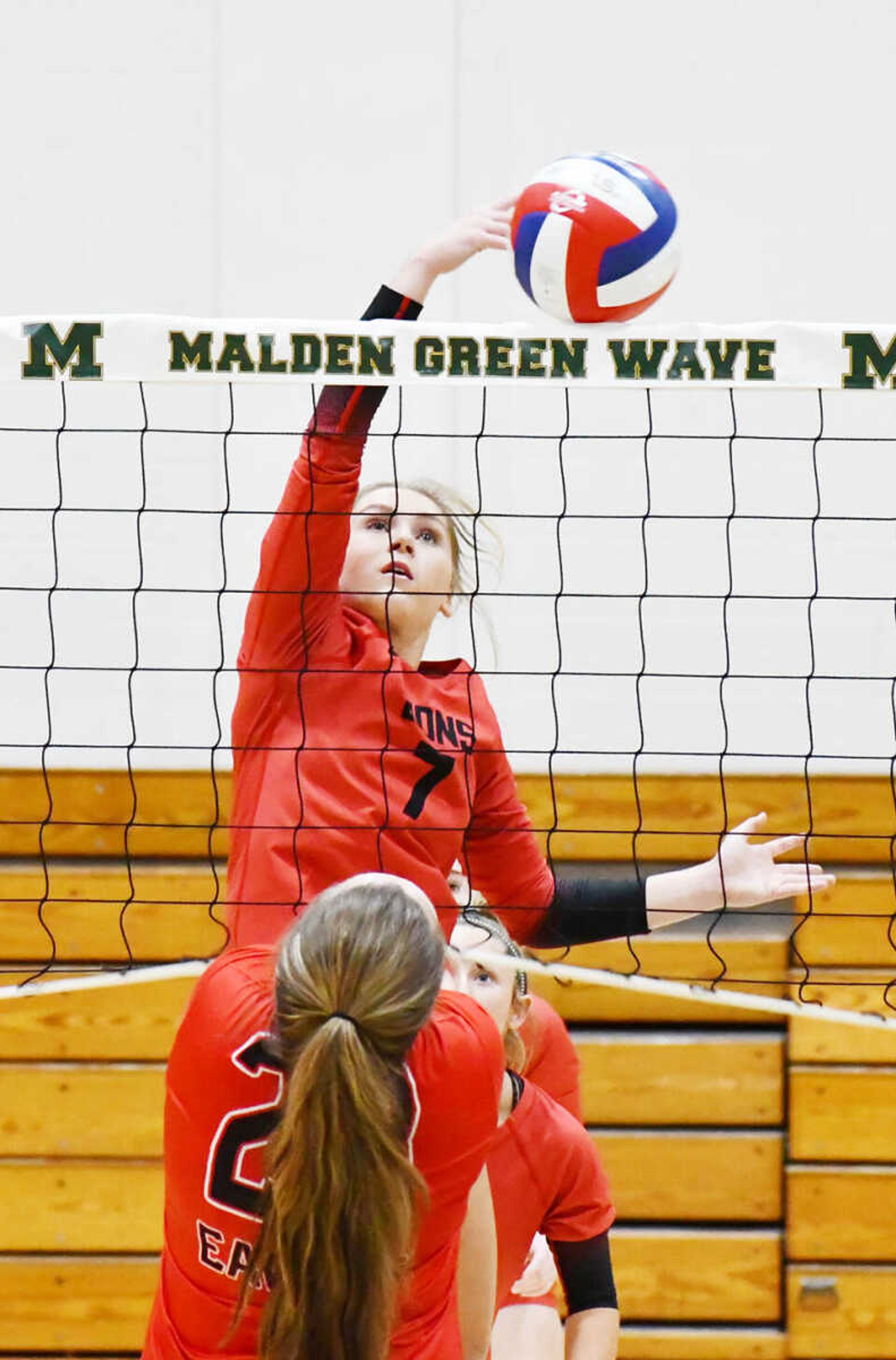 Senath-Hornersville’s Jada Burlison (7) tips the ball past East Prairie’s Jerzey Vinson during a high school playoff volleyball match dated Thursday, Oct. 19, 2023, in Malden.