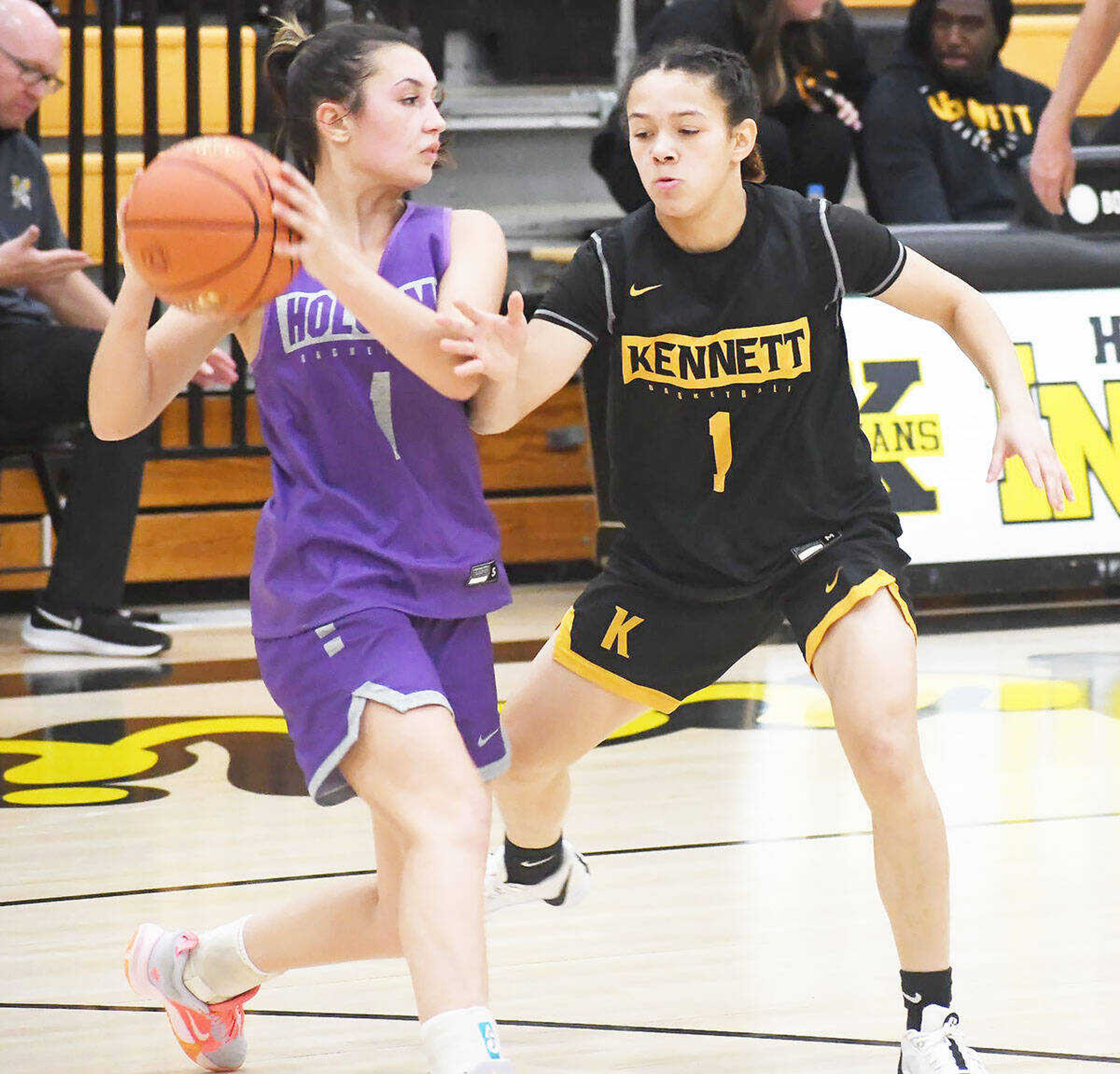 Holcomb’s Ava Gurley (left) looks for room to pass while defended by Kennett’s Alyce Edwards (1) during a girls basketball jamboree dated Thursday, Nov. 16, 2023, in Kennett.