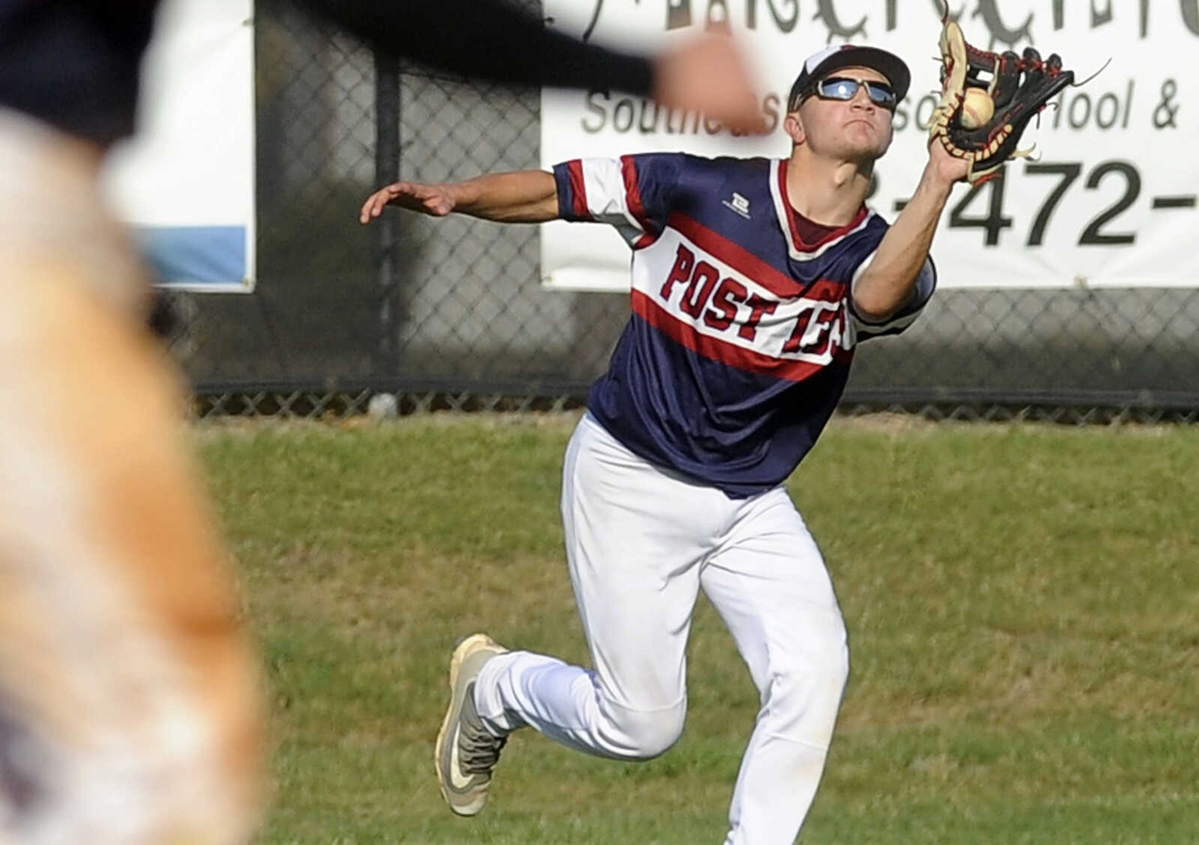 FRED LYNCH ~ flynch@semissourian.com
Perryville Post 133 right fielder Jacob Barks hauls in a Cape Girardeau Post 63 fly ball during the third inning of a quarterfinal in the Senior Legion District Tournament Thursday, July 12, 2018 in Sikeston, Missouri.