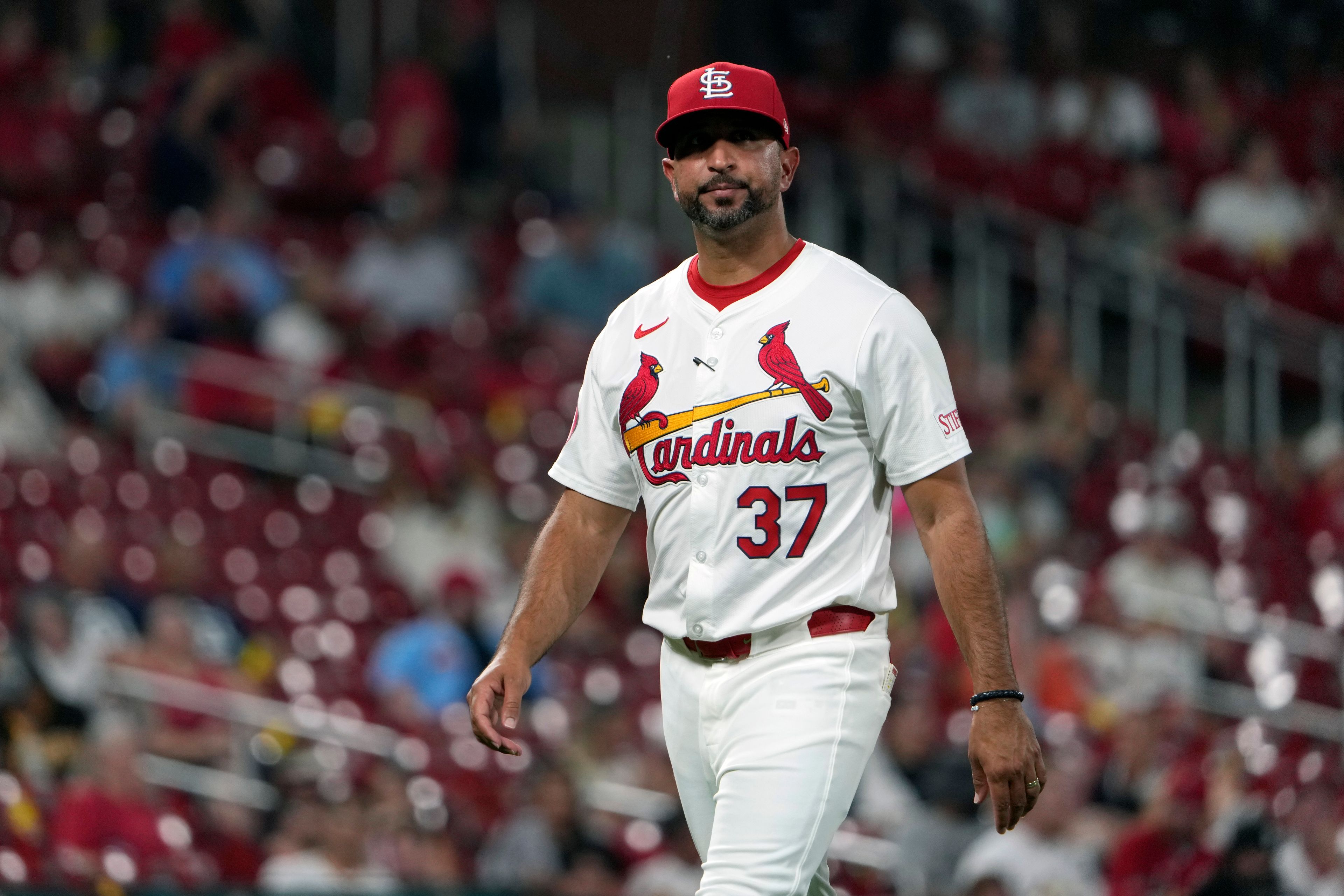 St. Louis Cardinals manager Oliver Marmol walks back from the mound after making a pitching change during the seventh inning of a baseball game against the San Diego Padres Tuesday, Aug. 27, 2024, in St. Louis. (AP Photo/Jeff Roberson)