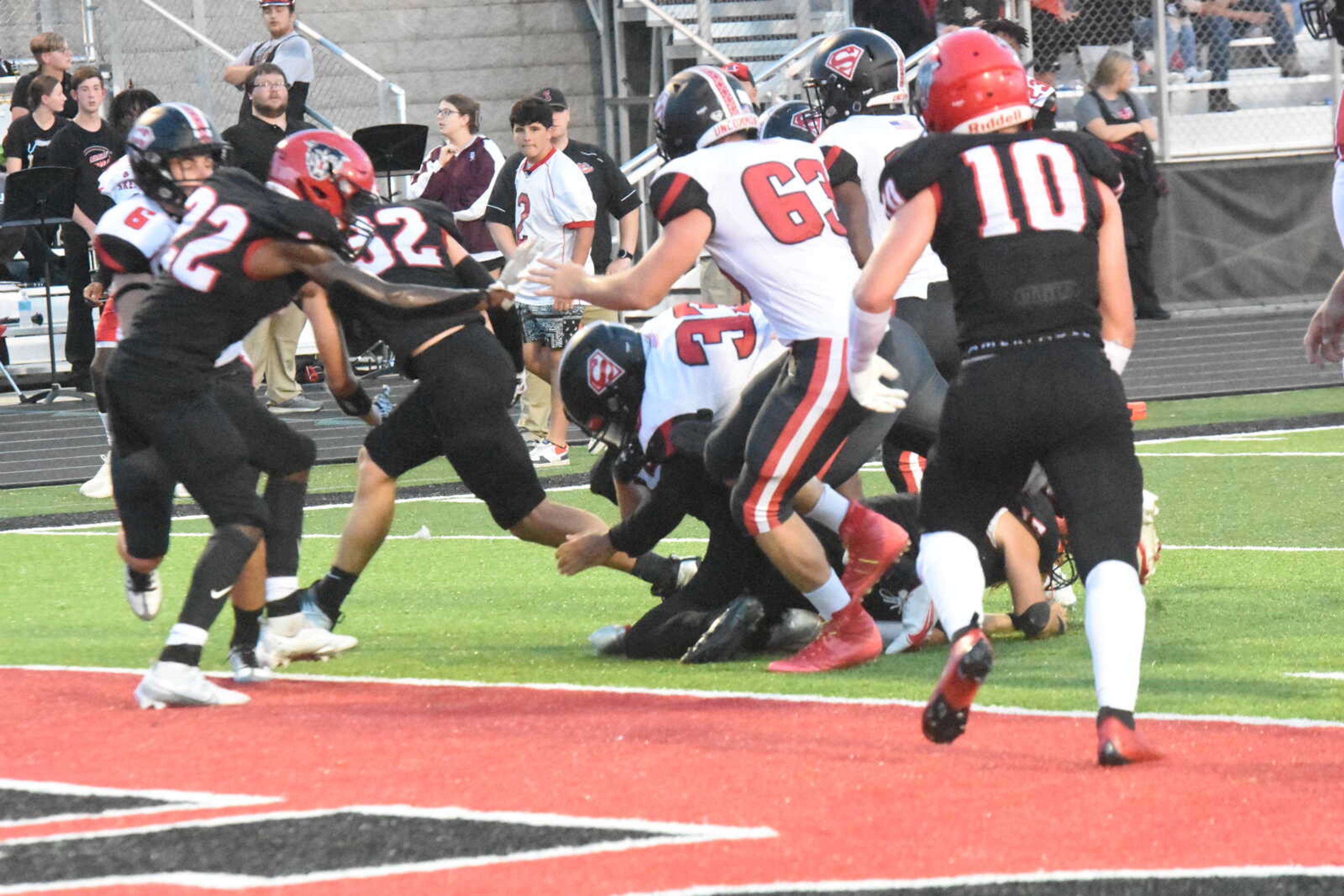 Sikeston's Keodrick Sherrod (33) lunges for the end zone in the first quarter Friday night.