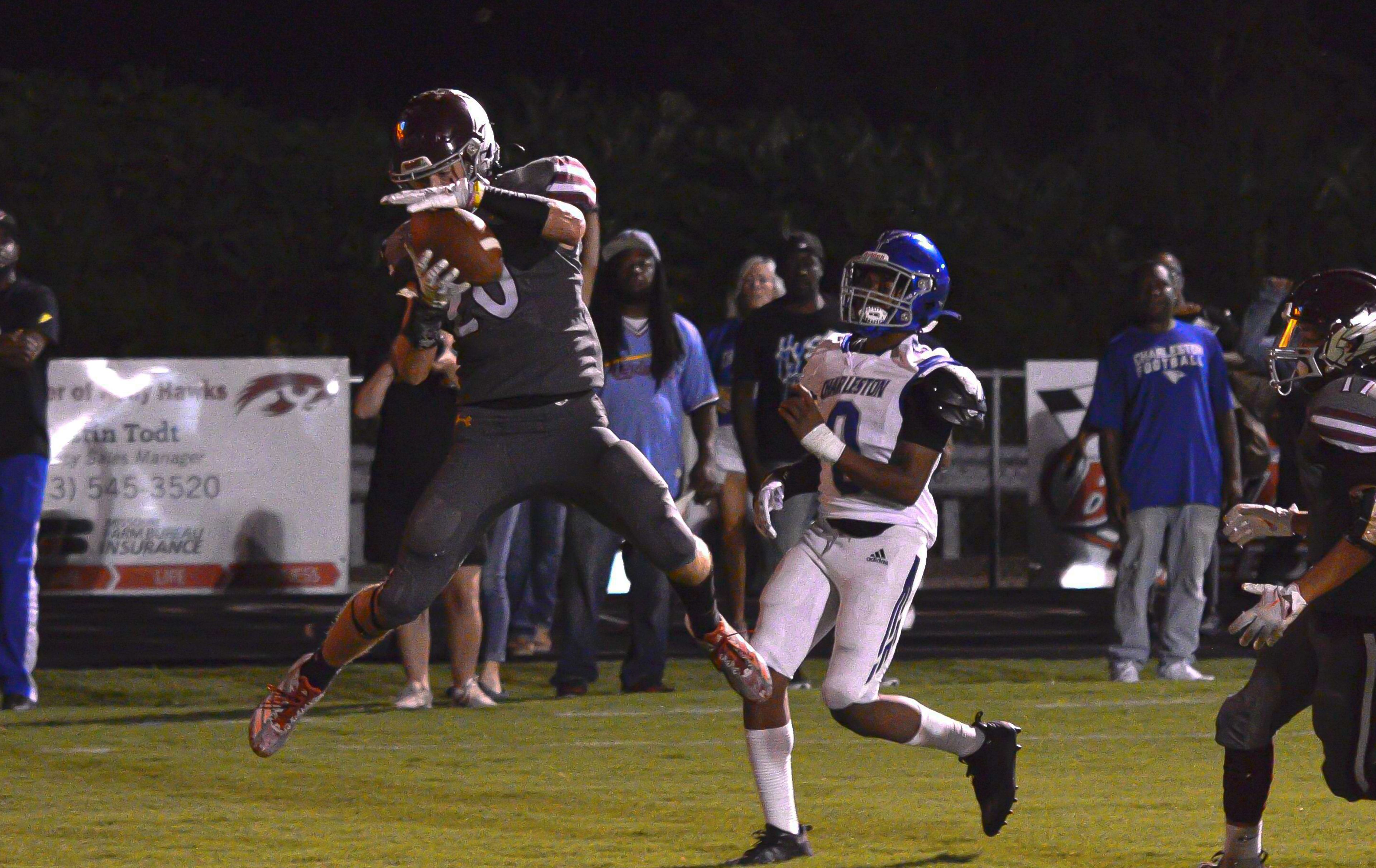 Kelly defensive back Grant Burleson intercepts a pass mid-air against Charleston on Friday, August 30, 2024 in Benton, Mo.