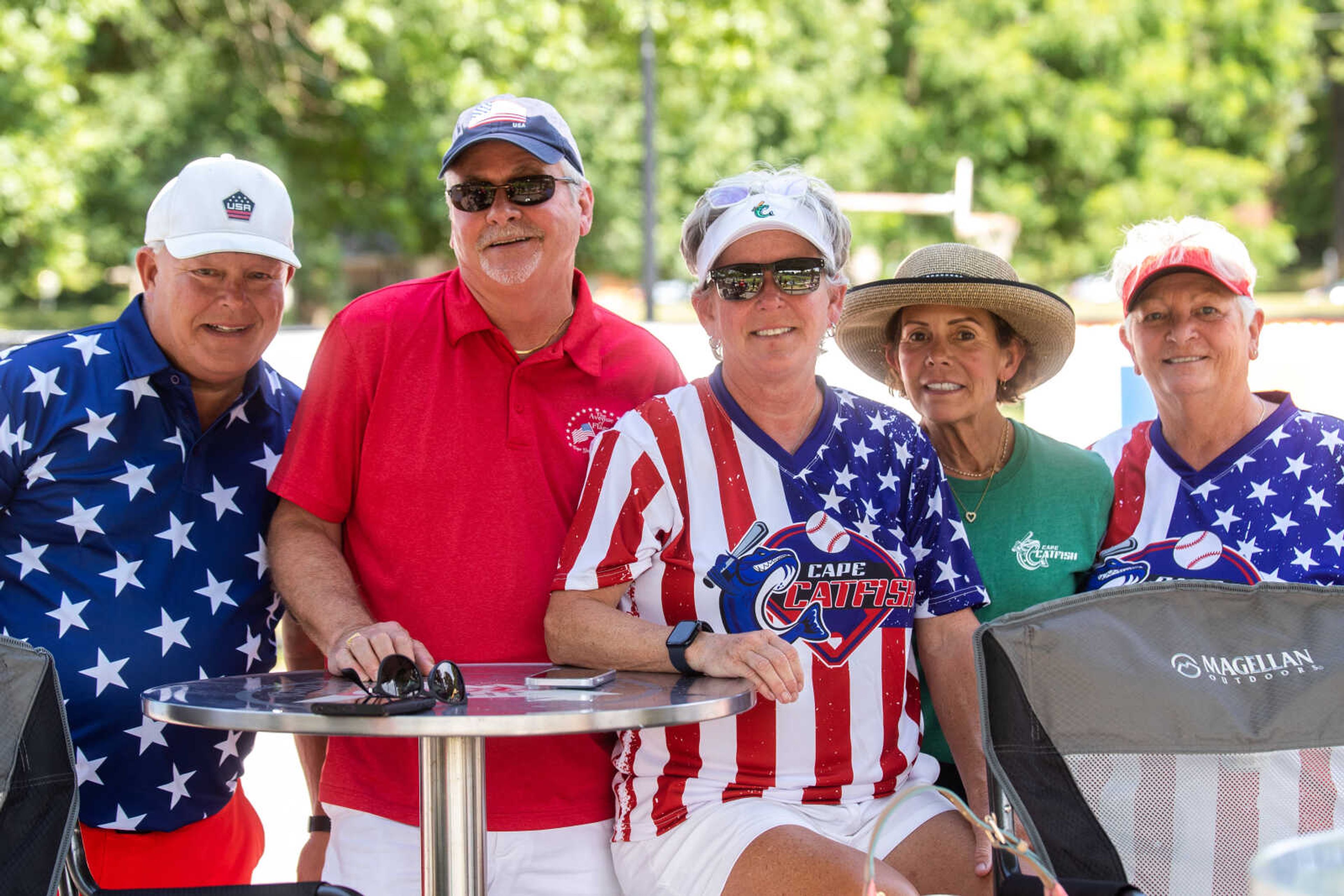 Mark Kneer, Chris Atkinson, Cindy Gannon, assistant general manager for the Cape Catfish, Julie McDonald and Donna Wheeler, director of sales and marketing for the Catfish, pose for a photo together on Flag Day at Capaha Field.