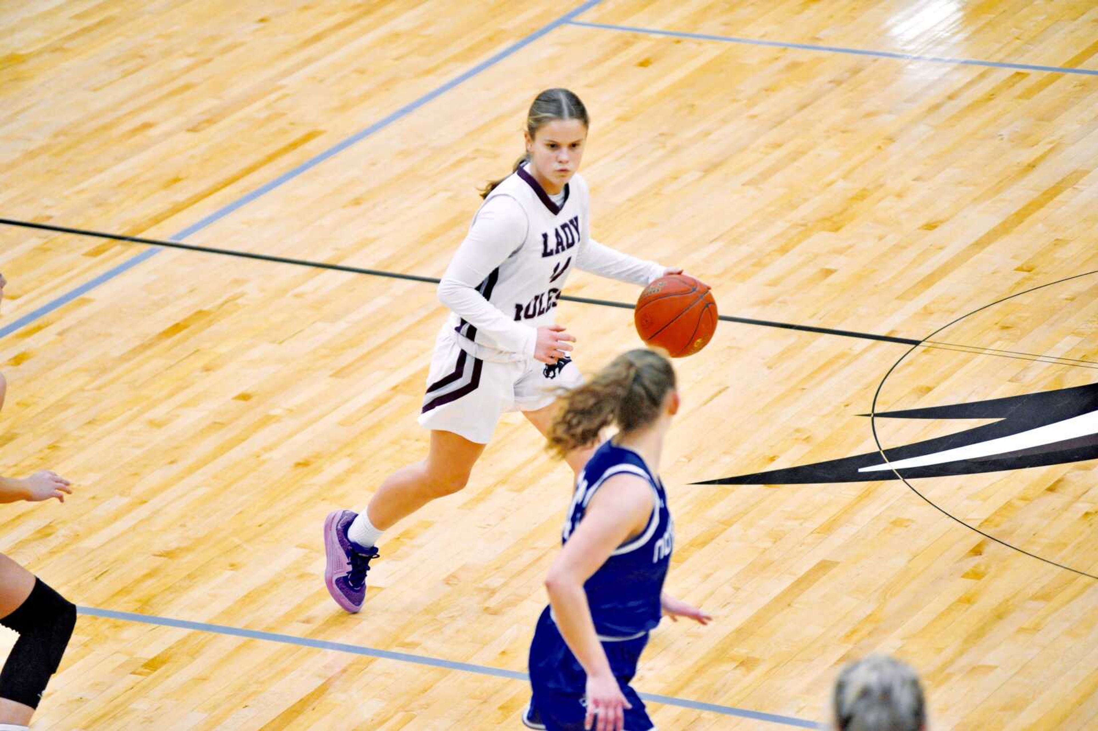 Poplar Bluff�s Kennedy Zgaynor surveys the Notre Dame defense during the Lady Mules� loss on Thursday. 